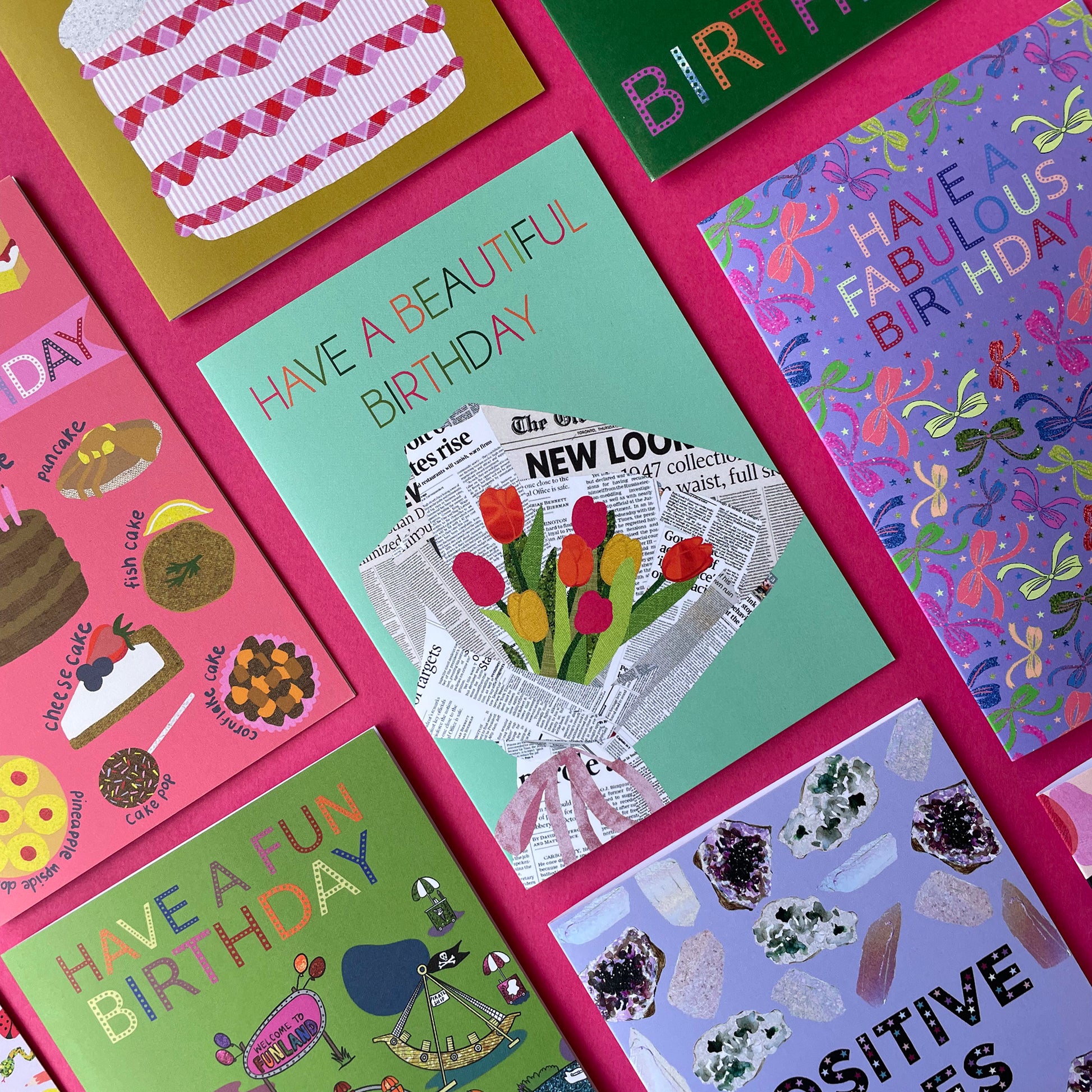 Image of a pastel green card that reads Have a Beautiful Birthday and features a unique, collaged illustration of a bouquet of tulips in newspaper.