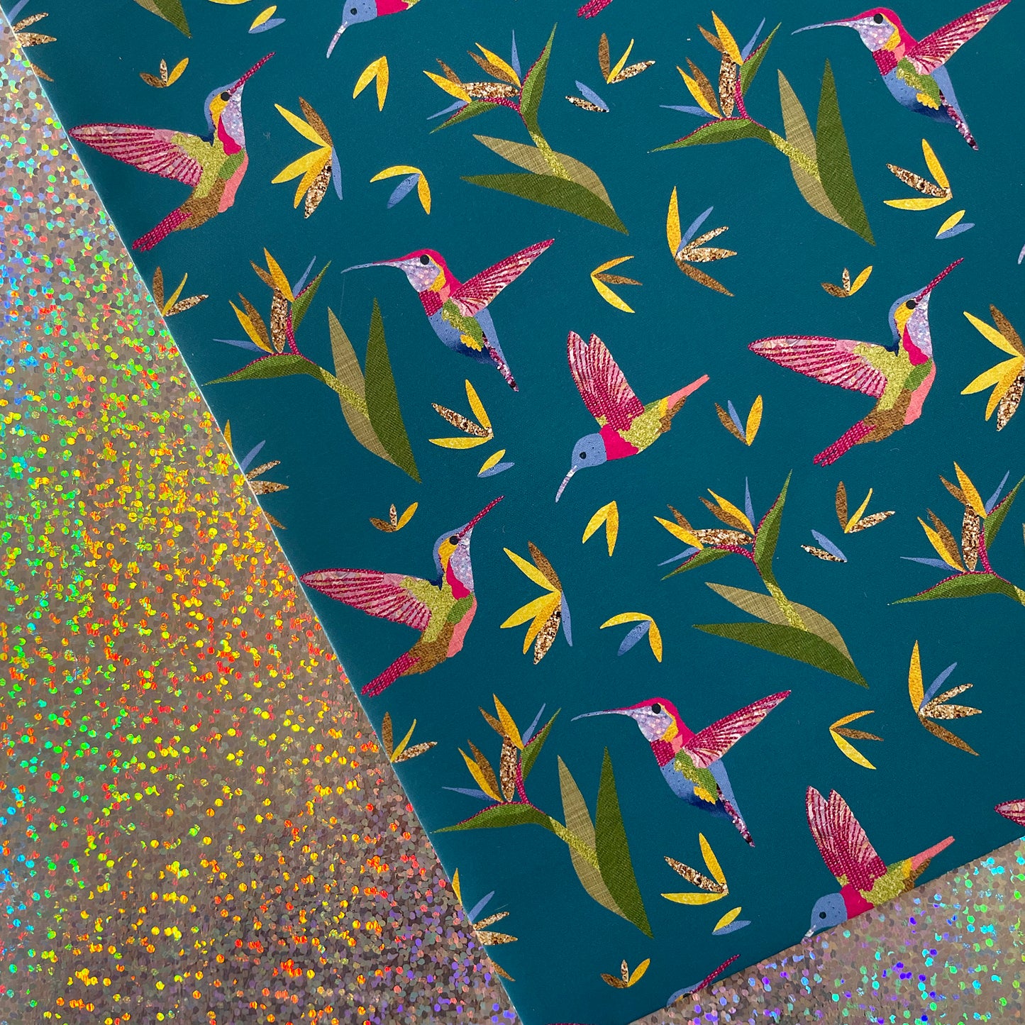Image shows a beautiful bird paradise gift wrap featuring a stylish hummingbird and plant design.