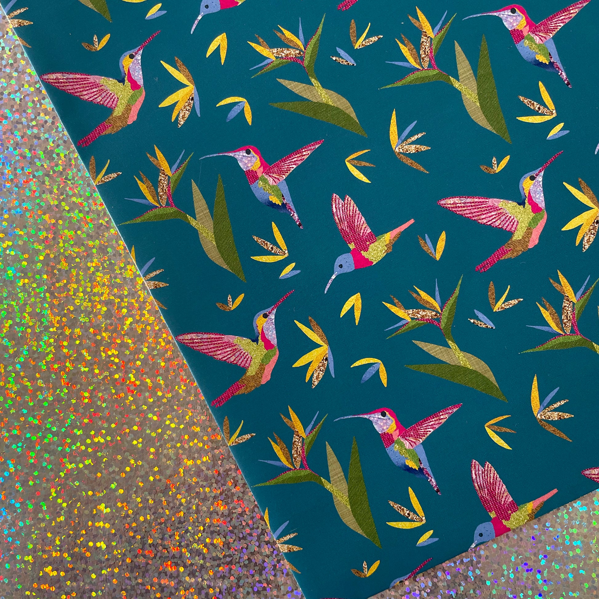 Image shows a beautiful bird paradise gift wrap featuring a stylish hummingbird and plant design.