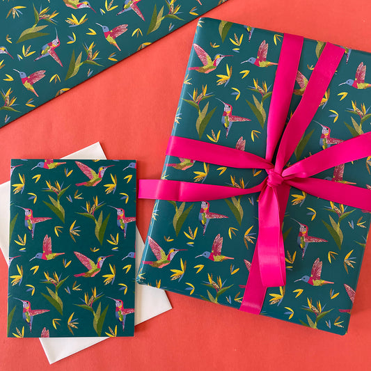 Image shows a beautiful bird paradise gift wrap featuring a stylish hummingbird and plant design.