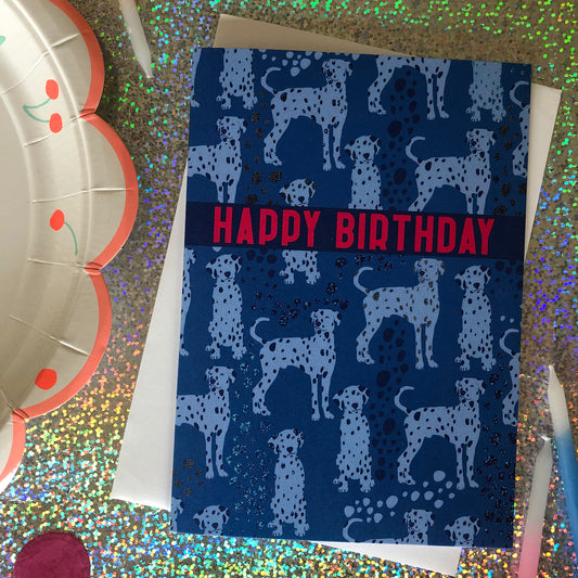 Blue Dalmatian print birthday card featuring a cute dog design on a blue background.