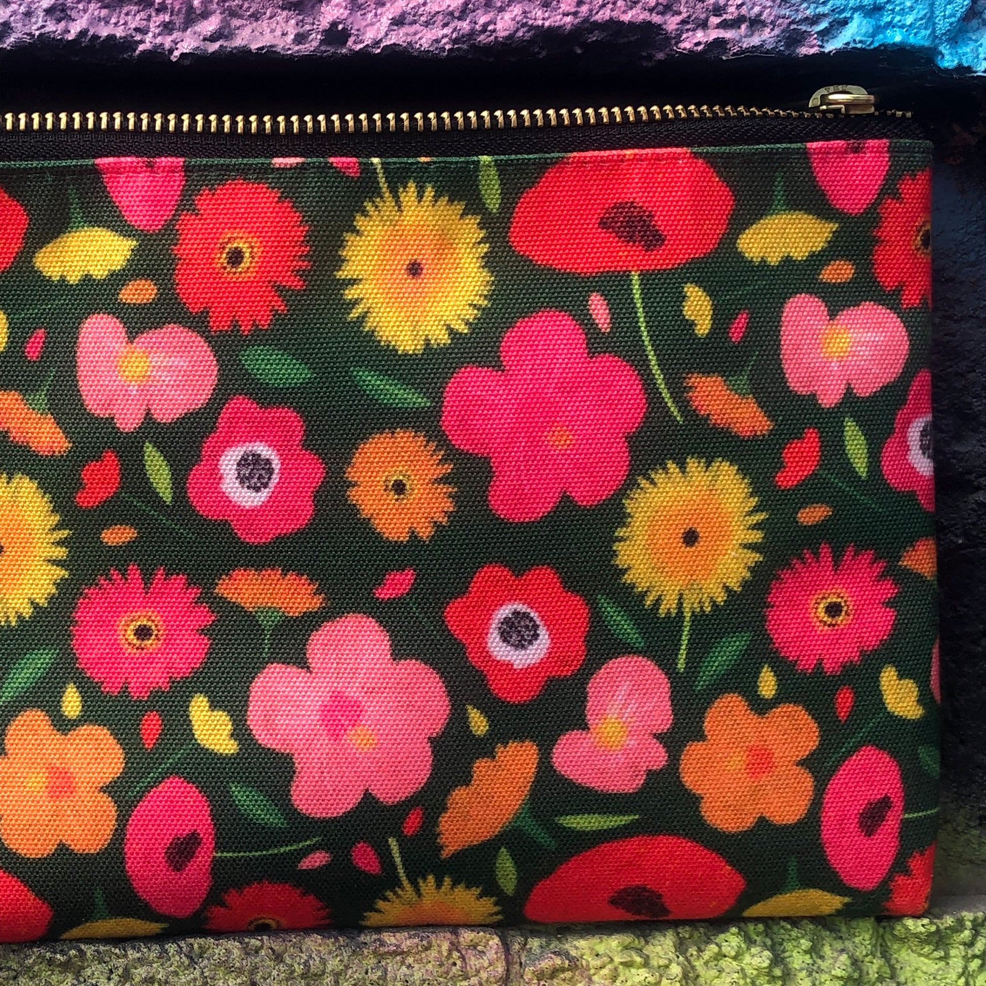 Useful zip pouch in a lush green colour with a pretty pink, yellow and orange floral print