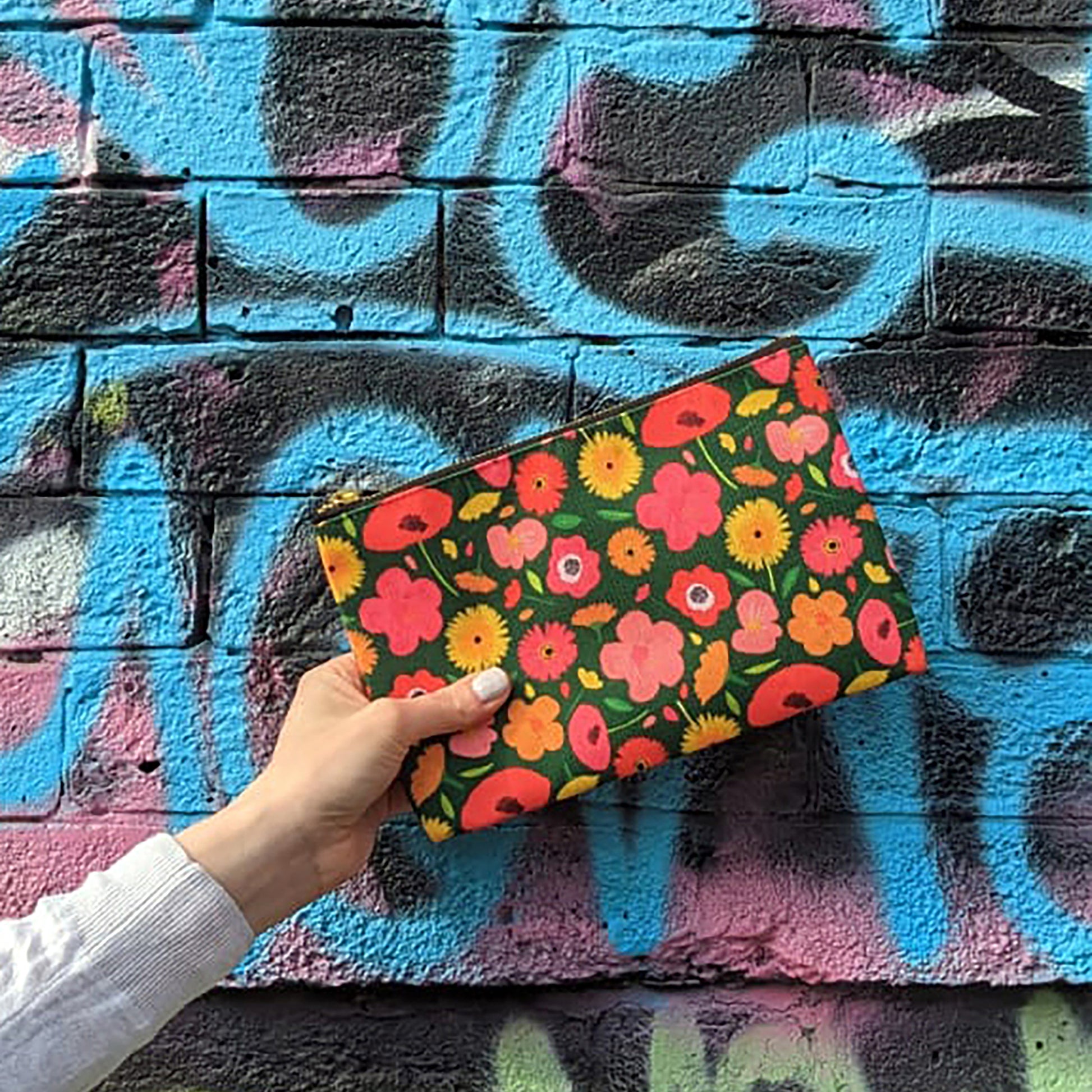 Useful zip pouch in a lush green colour with a pretty pink, yellow and orange floral print