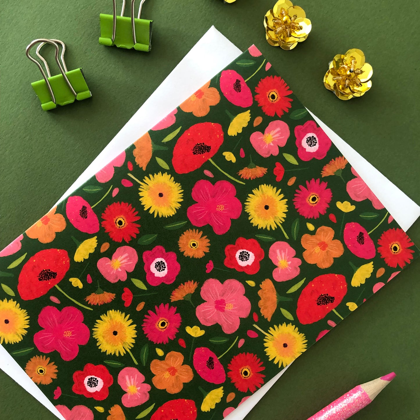 Image shows a green floral print notecard