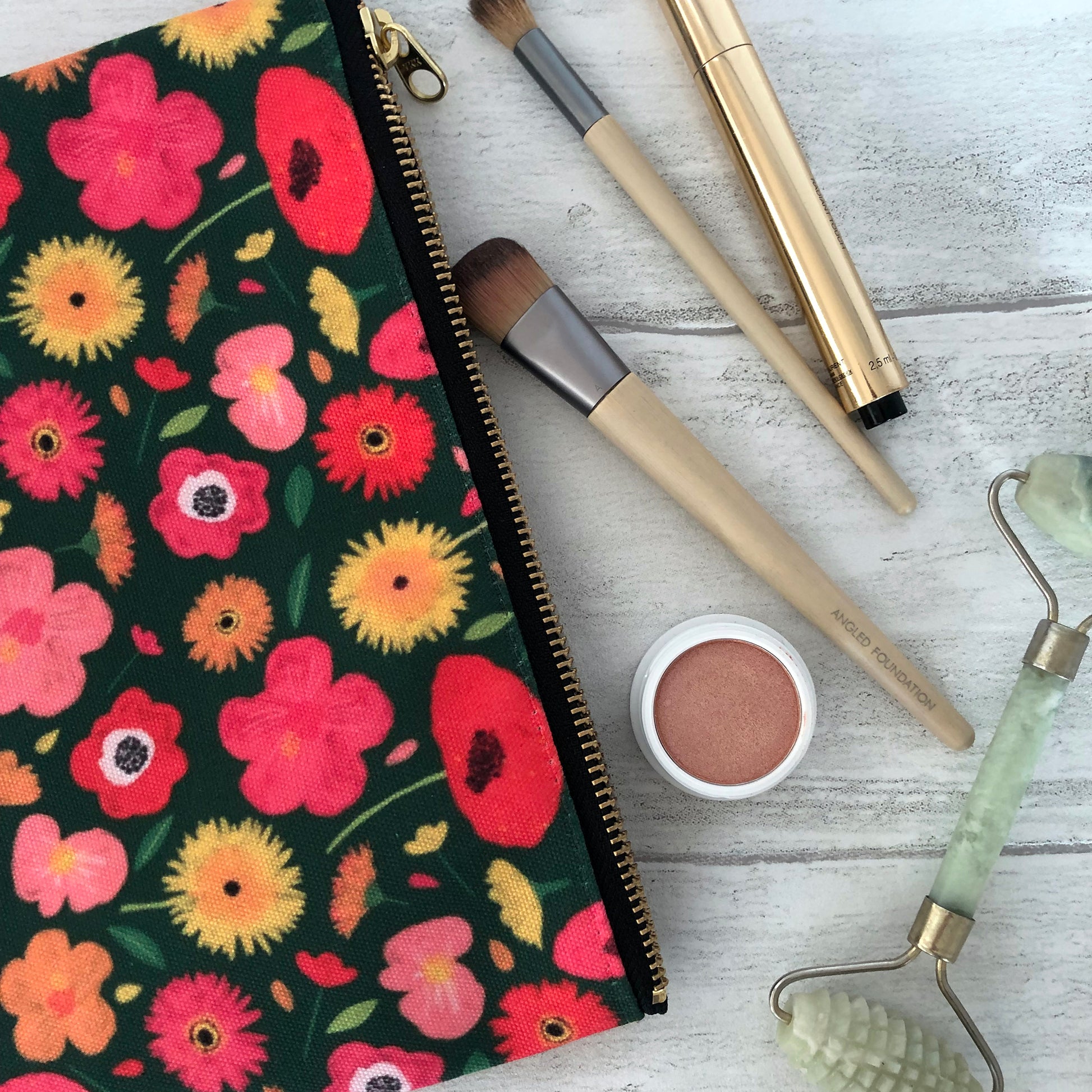 Useful zip pouch in a lush green colour with a pretty pink, yellow and orange floral print