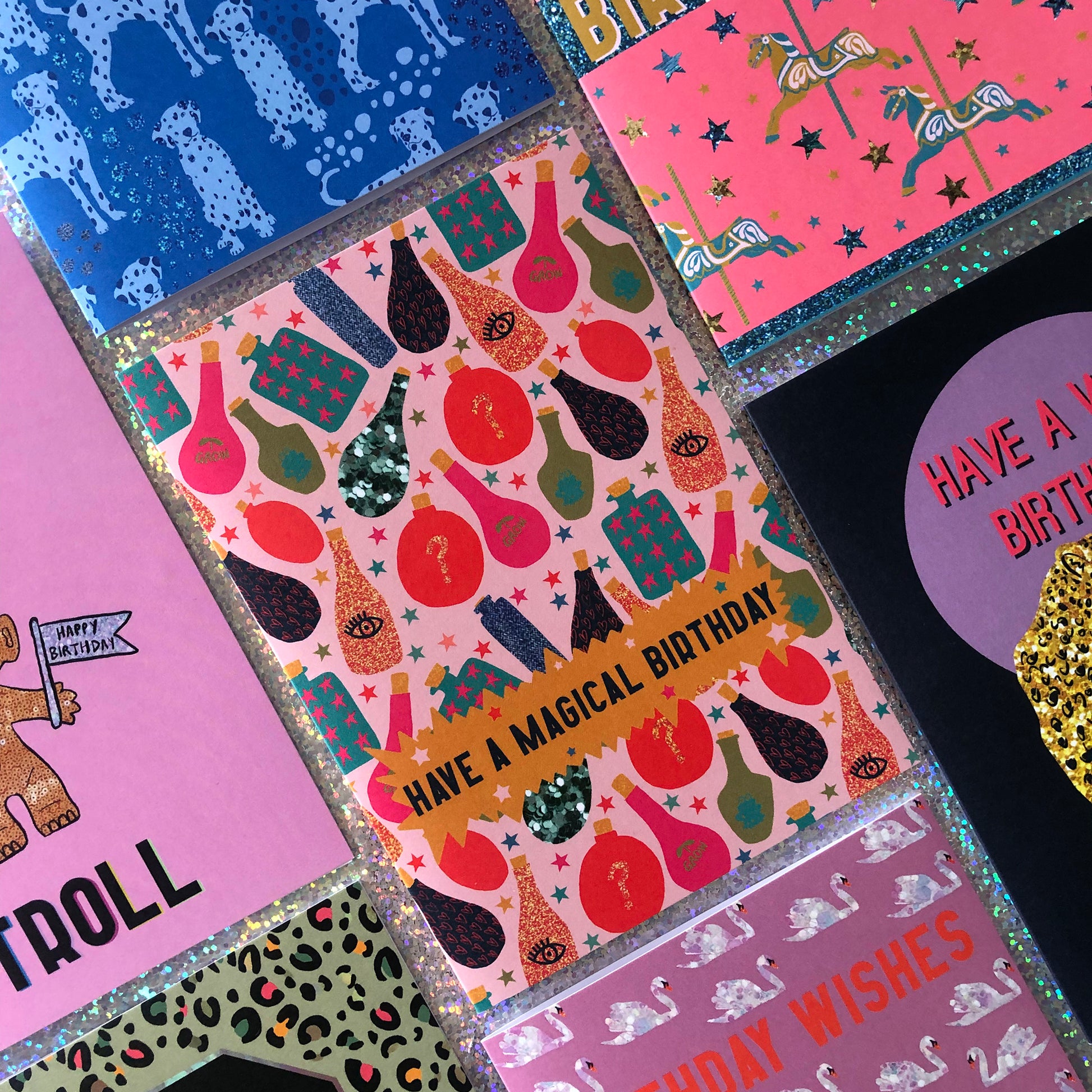 Image shows a fun, magical birthday card with colourful magic potion illustrations and the wording' have a magical birthday'
