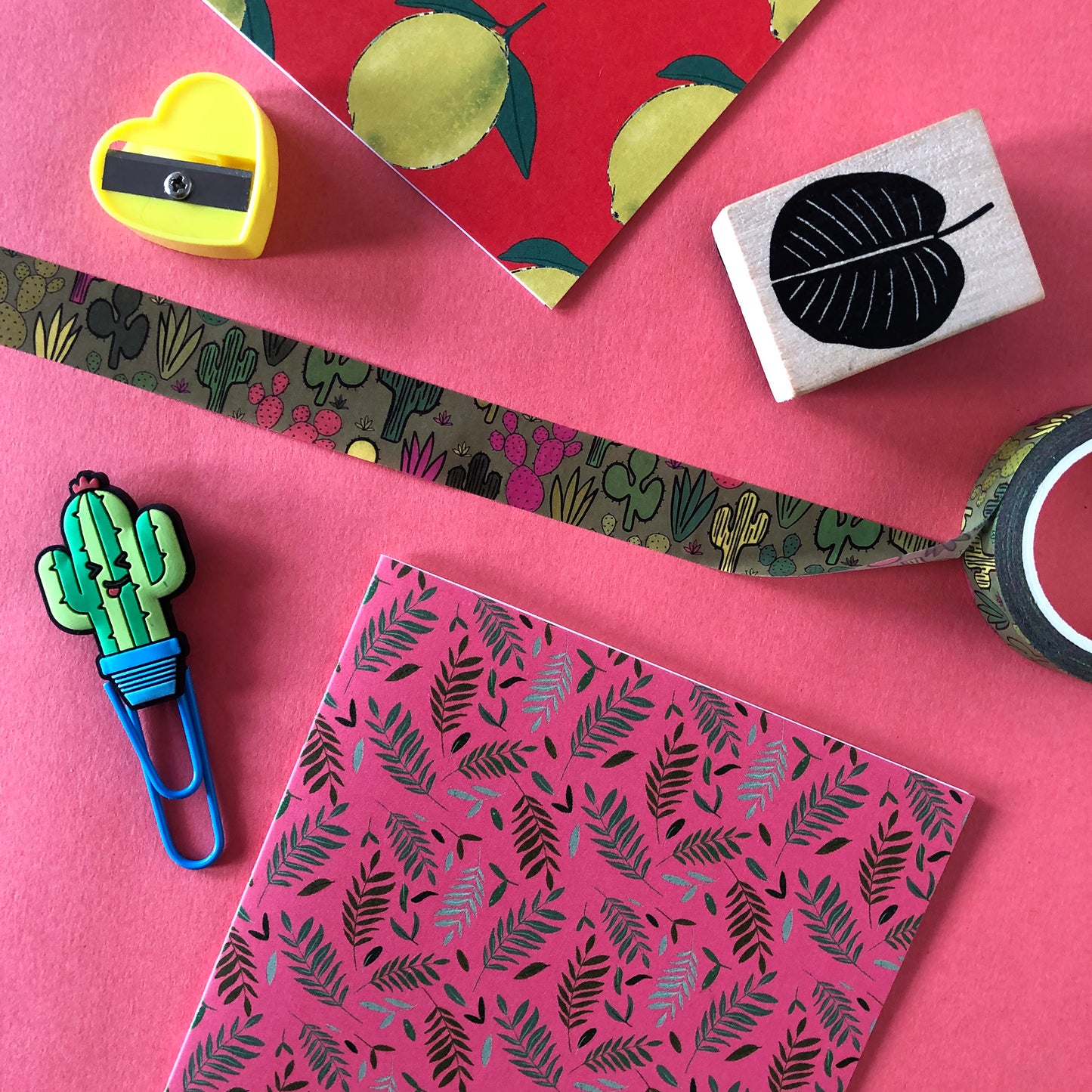 Image shows a green washi tape with a colourful cactus plant print