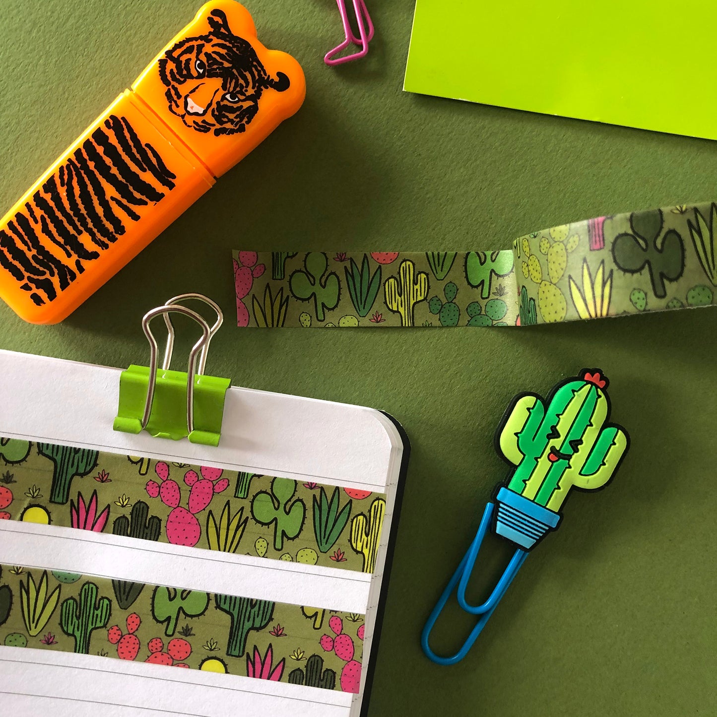 Image shows a green washi tape with a colourful cactus plant print