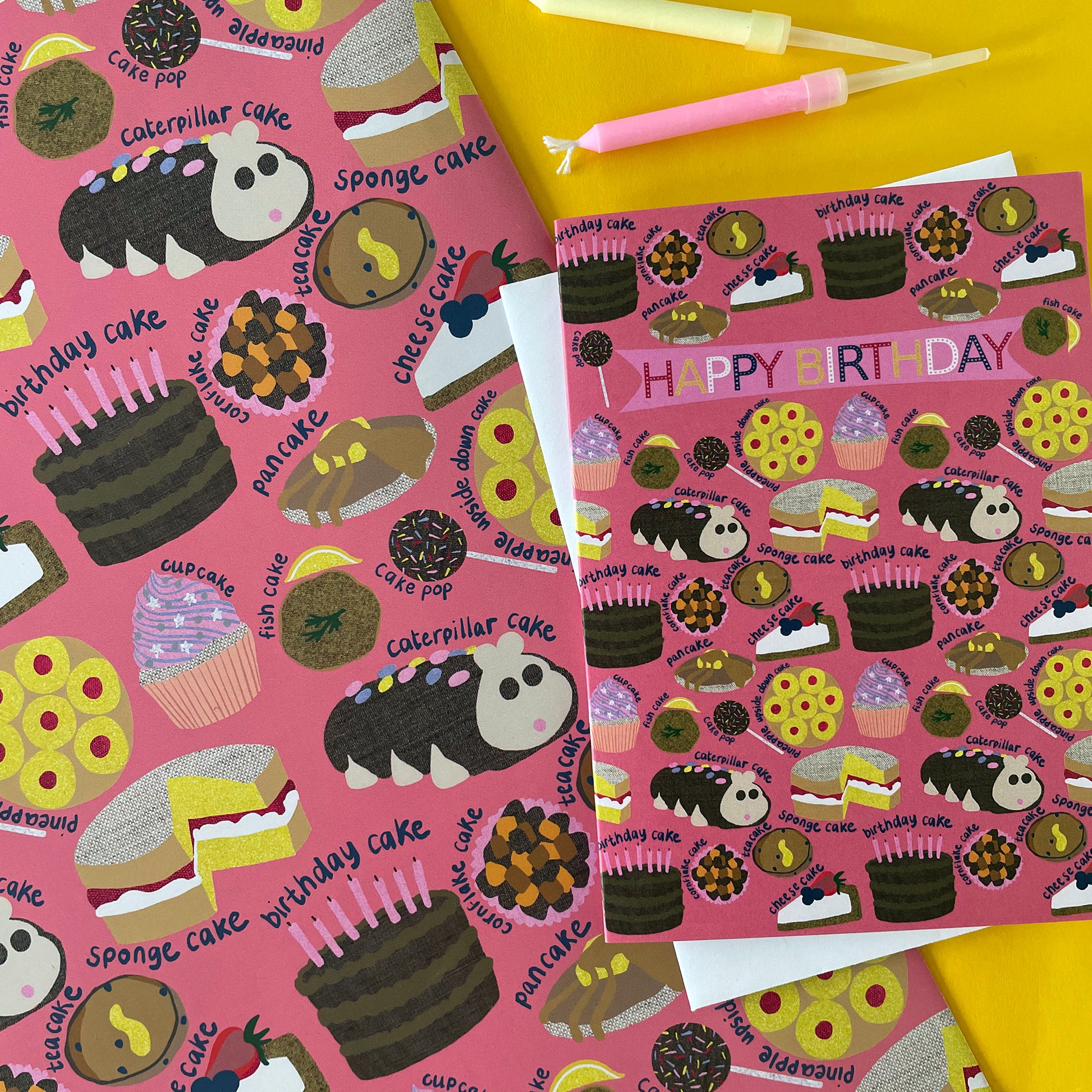 Image shows a pink gift wrap with a fun cake pattern