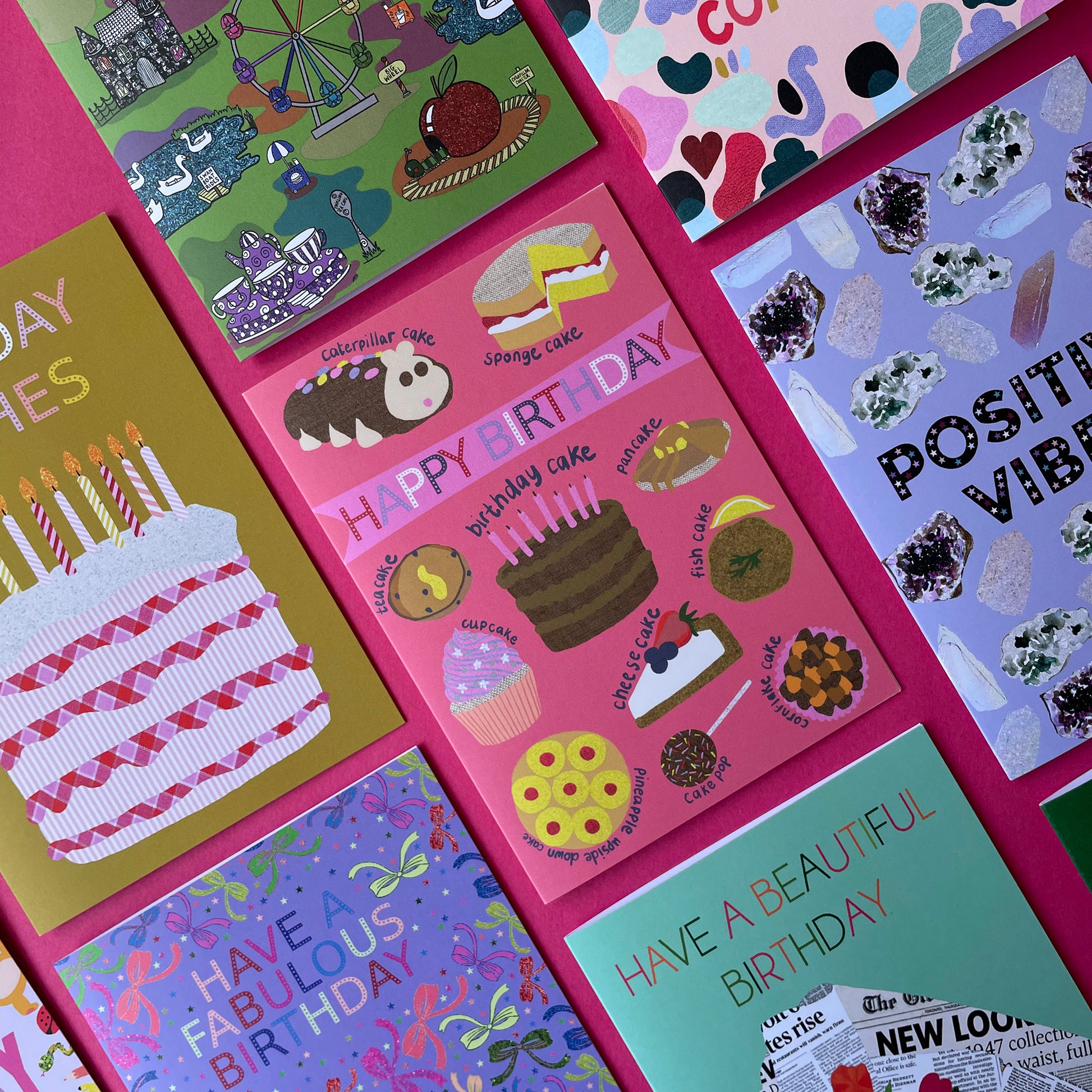 Image shows a pink birthday card with illustrations of different sorts of cakes and the words Happy Birthday