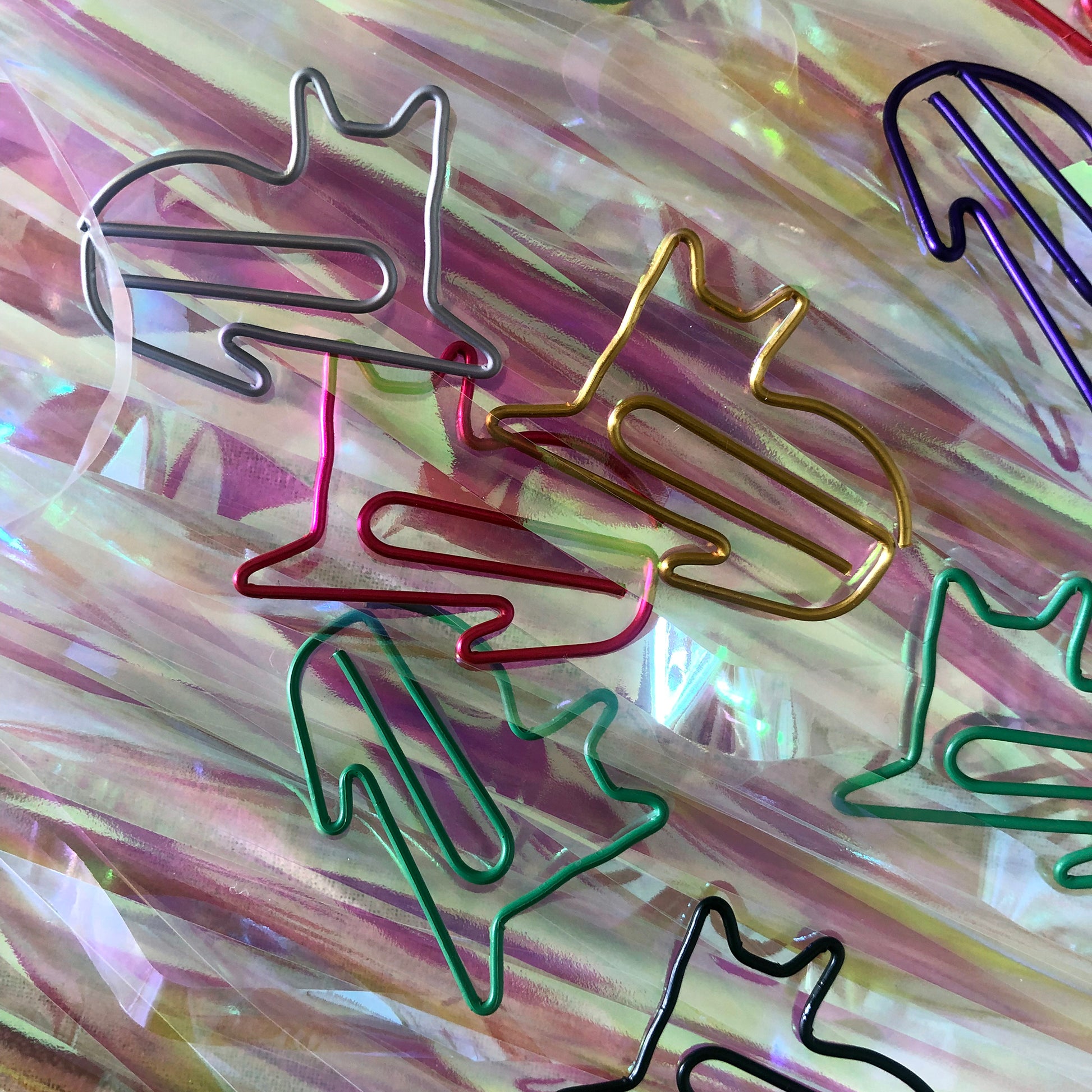 Image shows a set of cute and colourful, cat shaped paperclips.