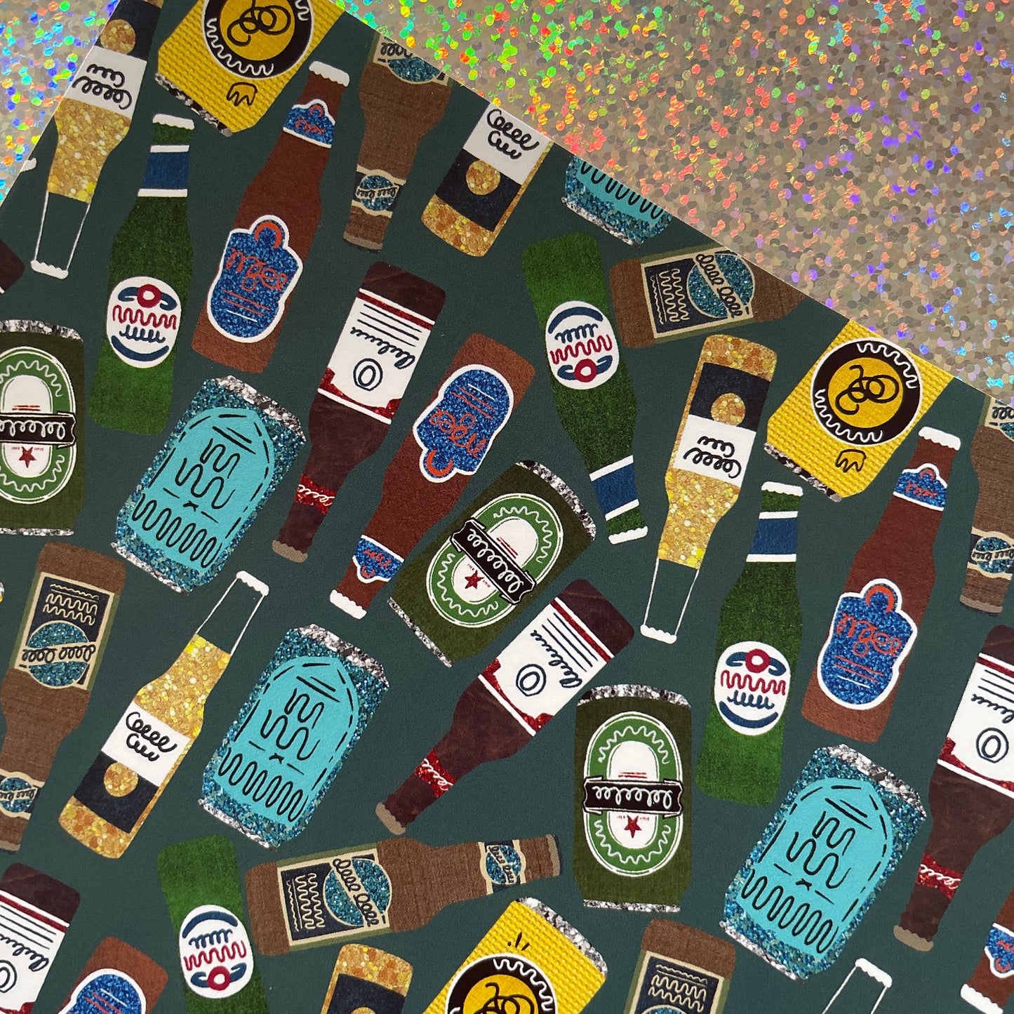 Image shows a green blue gift wrap with illustrations of different beers patterned design
