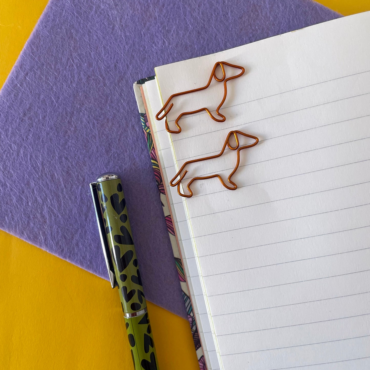 Image shows a cute set of Dachshund shaped paper clips