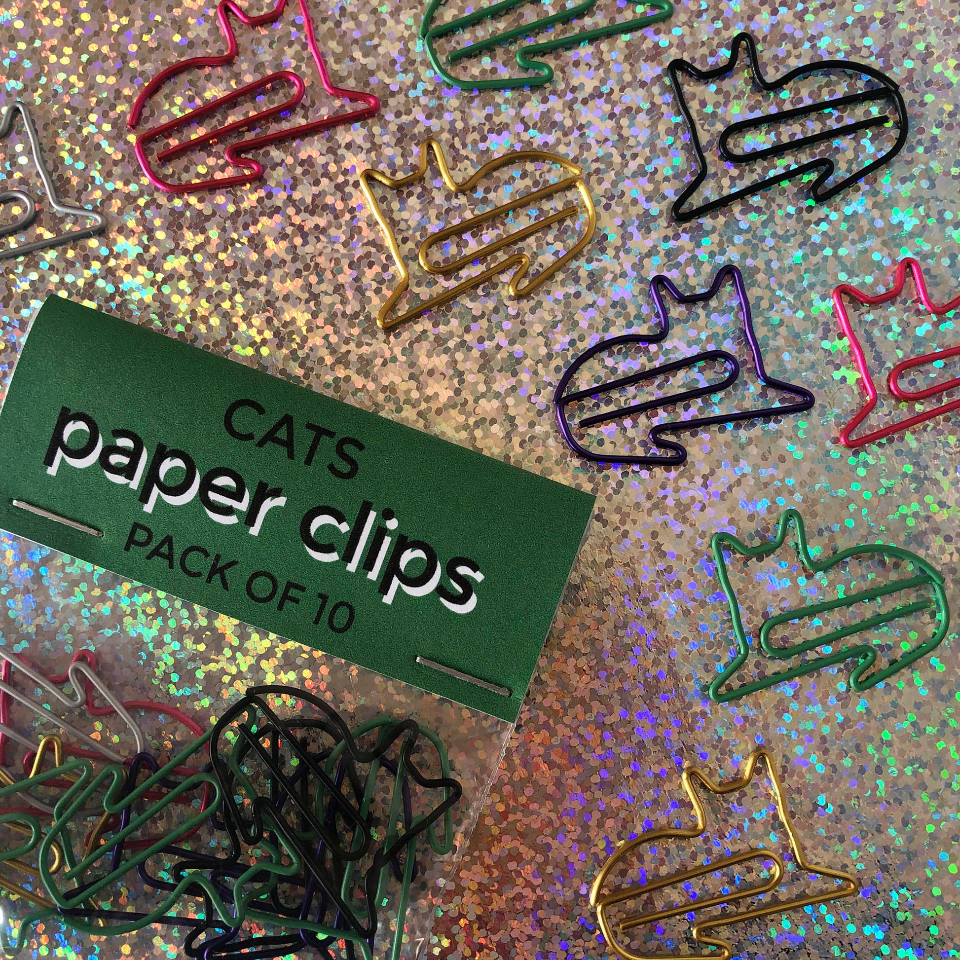 Image shows a set of cute and colourful, cat shaped paperclips.