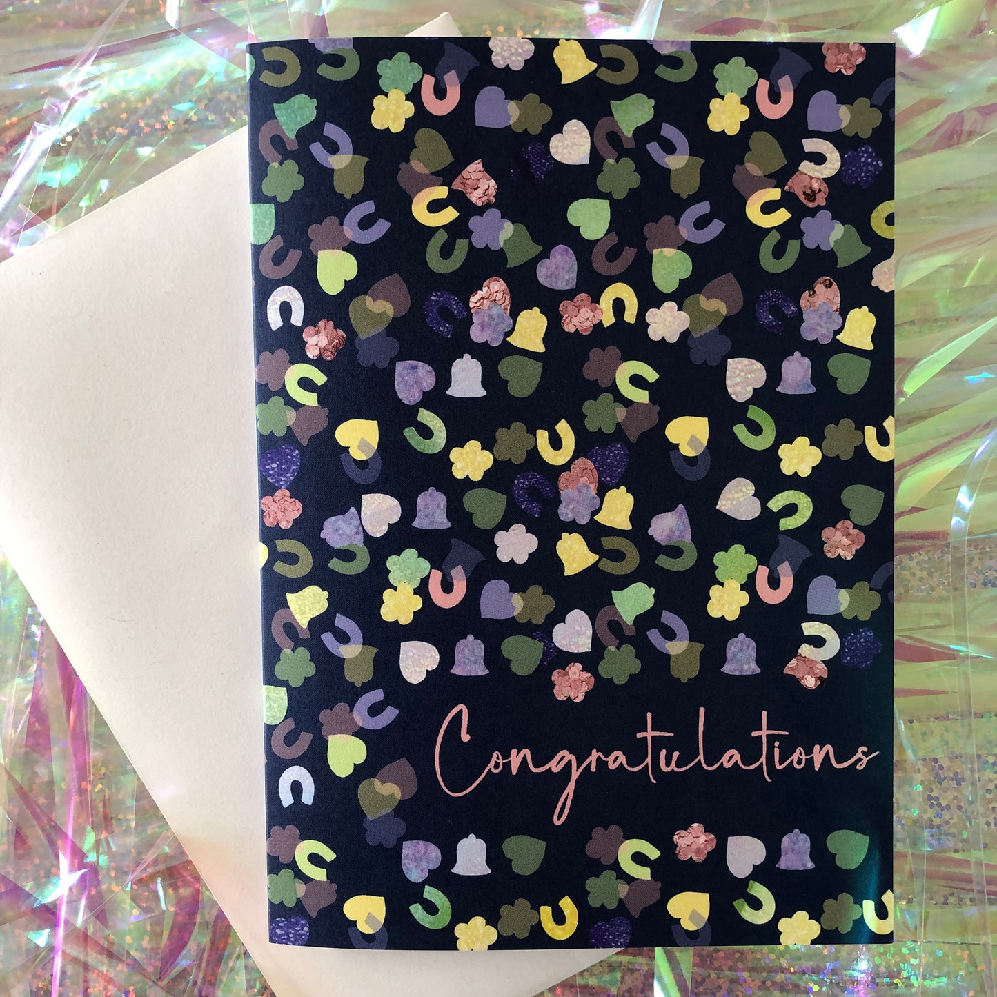 Image shows a navy blue card with a confetti print pattern and 'Congratulations' in pink writing