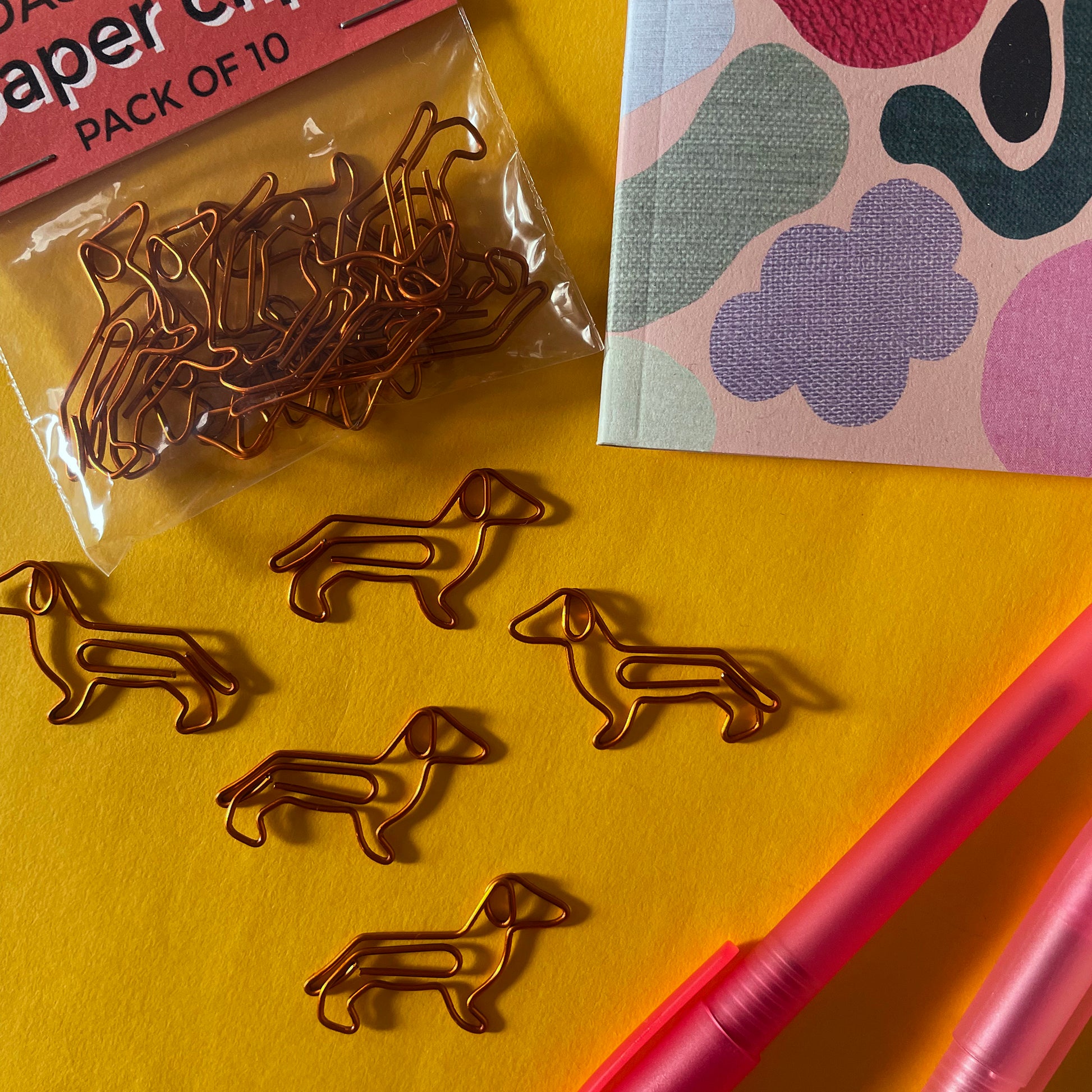 Image shows a cute set of Dachshund shaped paper clips