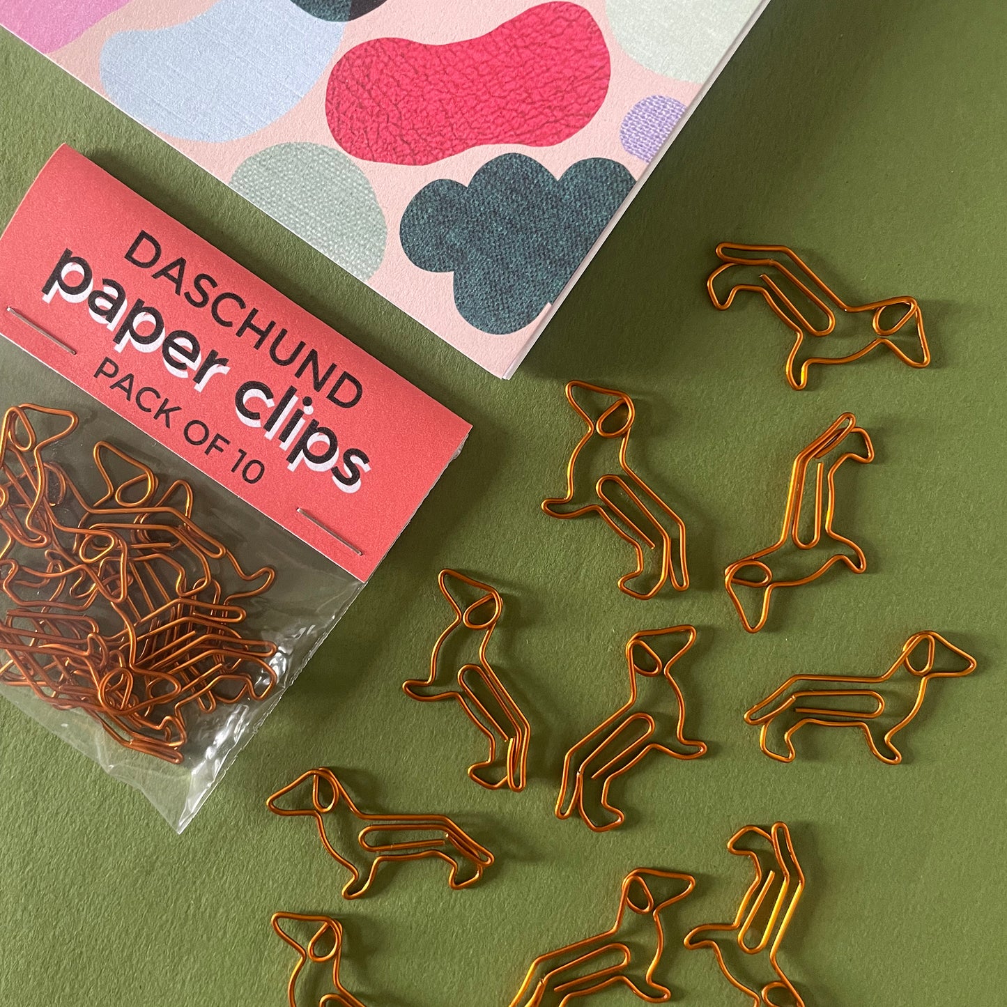Image shows a cute set of Dachshund shaped paper clips