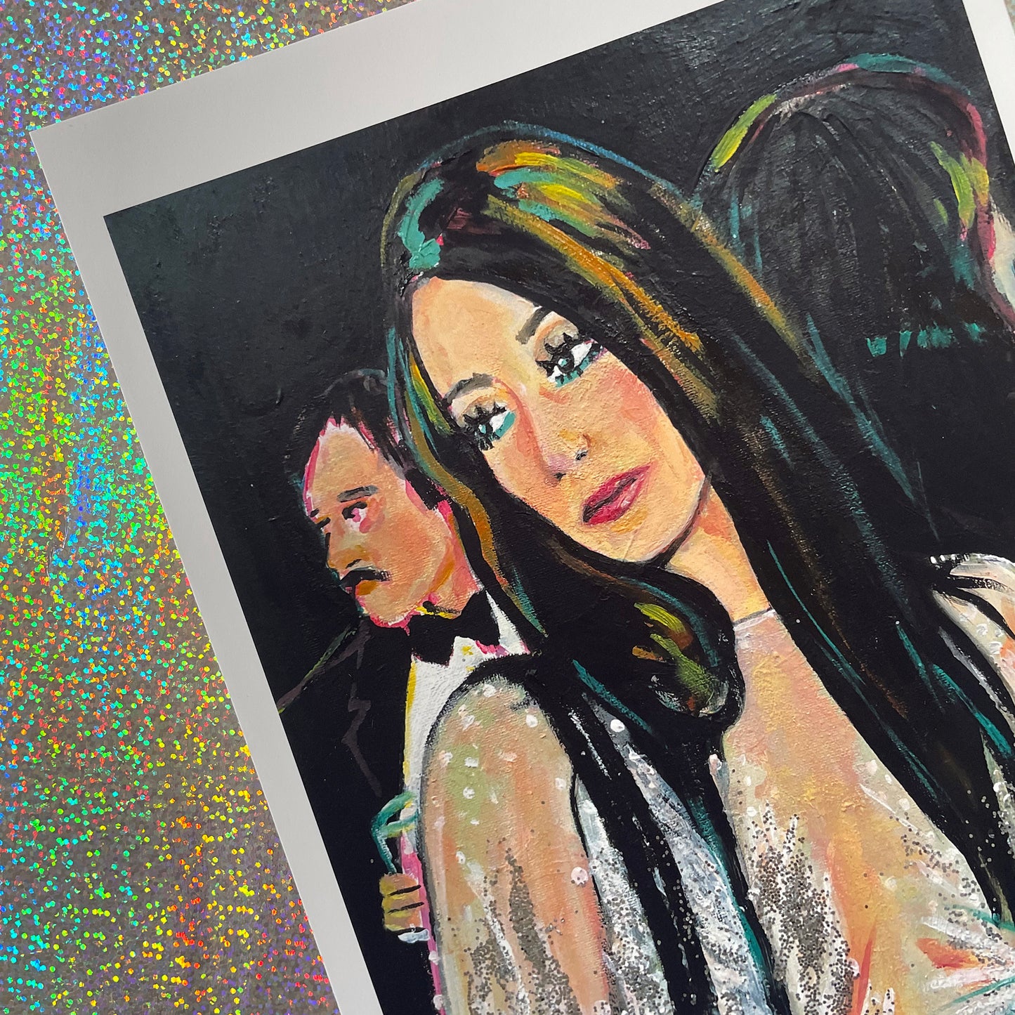 Image shows a framed portrait of Cher at studio 54 wearing a silver sparkly outfit with feathered sleeves.