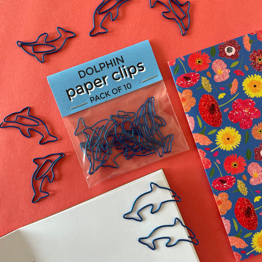 Image shows a fun set of 10 dolphin shaped paper clips in bright, metallic blue