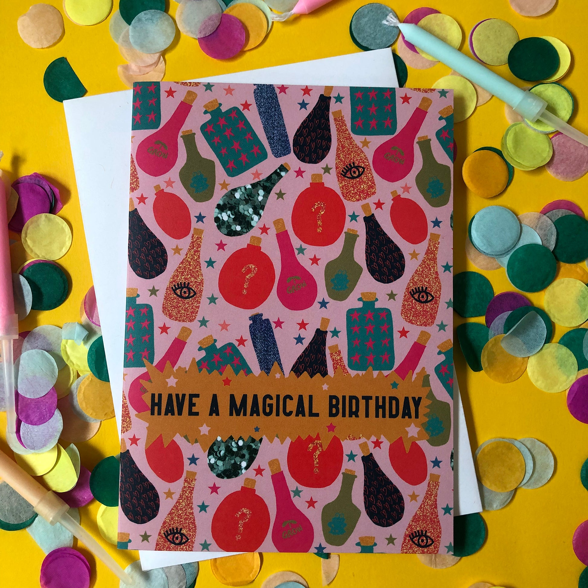 Image shows a fun, magical birthday card with colourful magic potion illustrations and the wording' have a magical birthday'