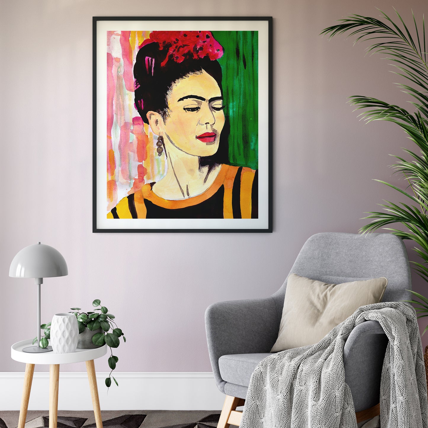 Image of a framed, illustrated portrait of Frida Kahlo in bright and colourful inks