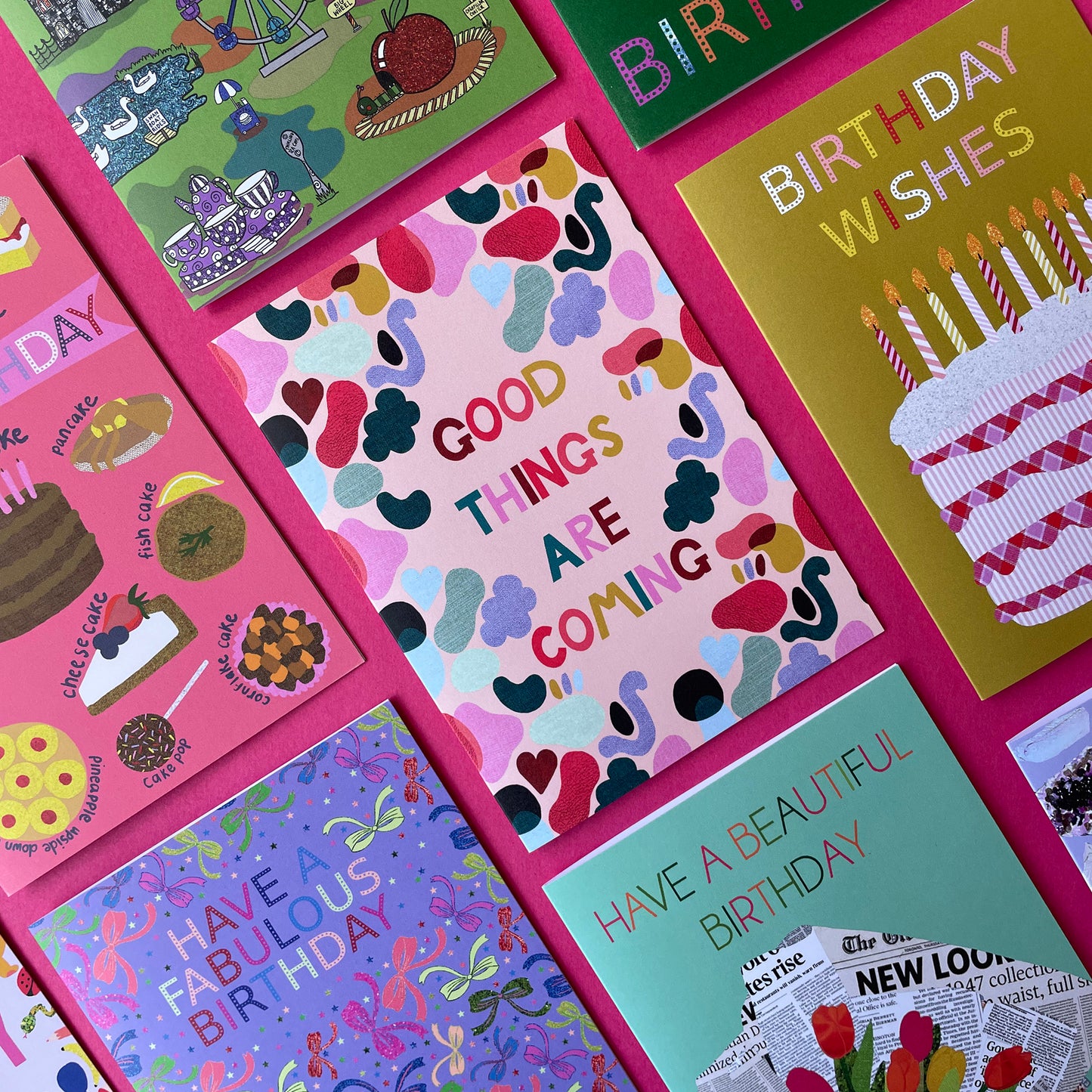 Image of a bright and colourful card with an abstract shape design and the words 'Good Things Are Coming'