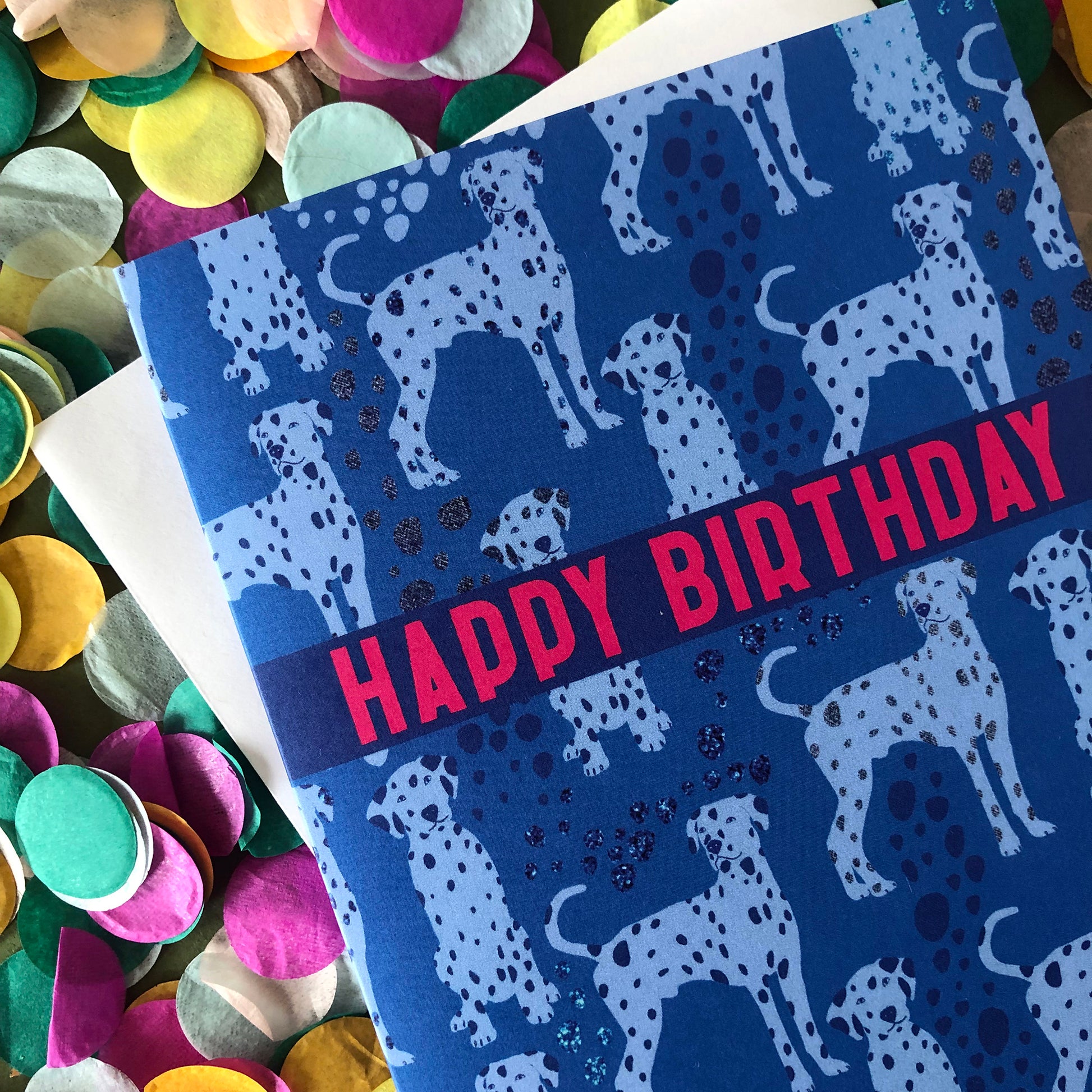 Blue Dalmatian print birthday card featuring a cute dog design on a blue background.
