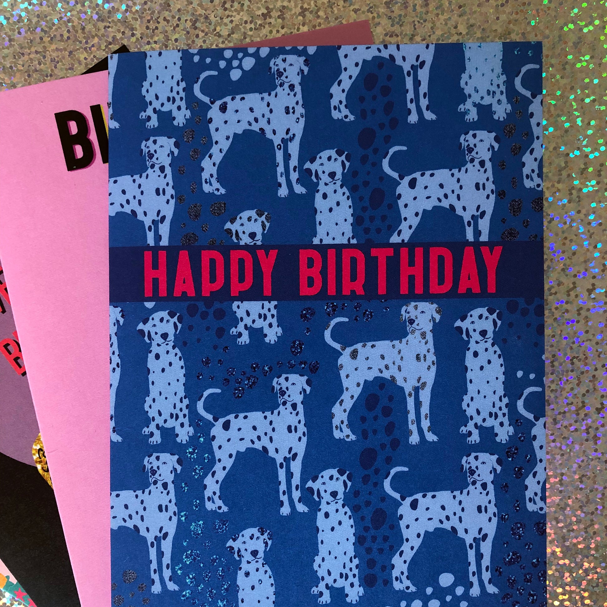 Blue Dalmatian print birthday card featuring a cute dog design on a blue background.