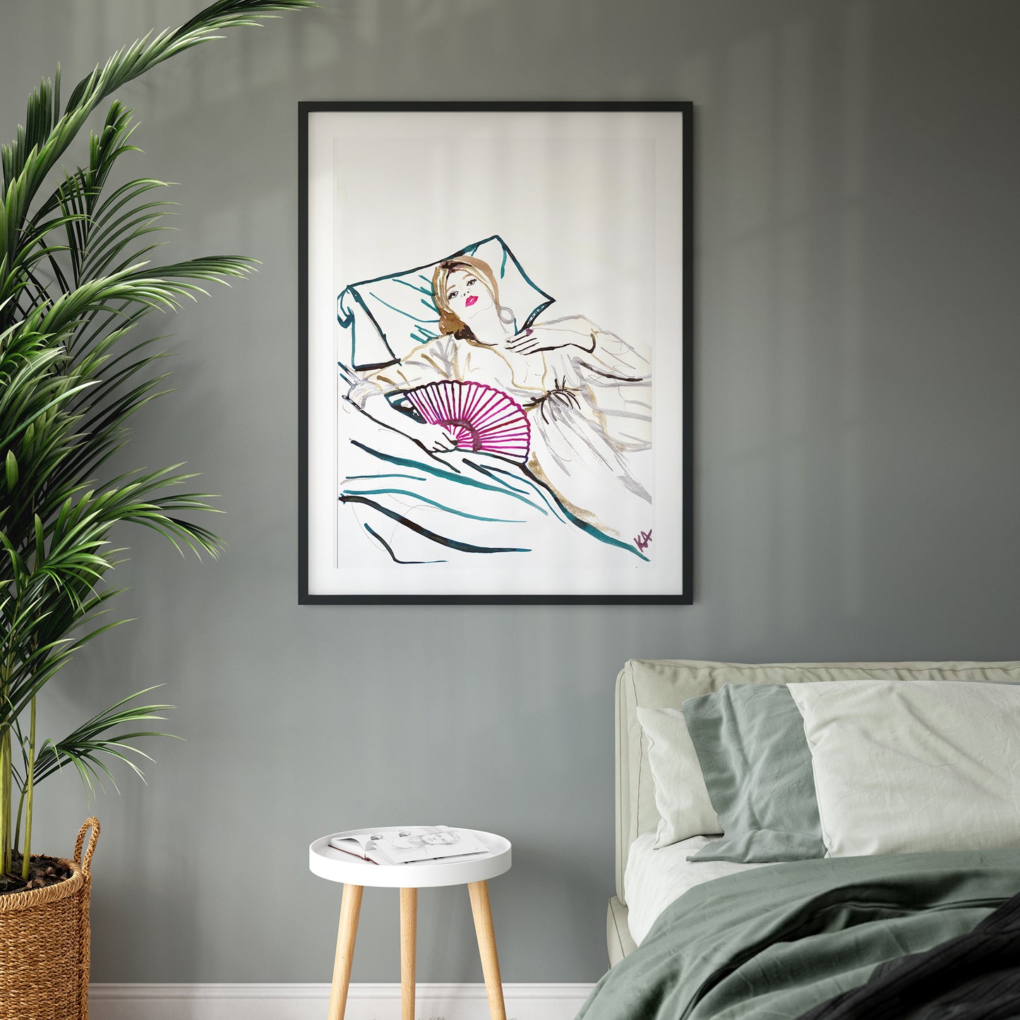Image of a framed piece of art. An ink illustration of a woman lying on a bed with a fan. Hand drawn in drawing inks.