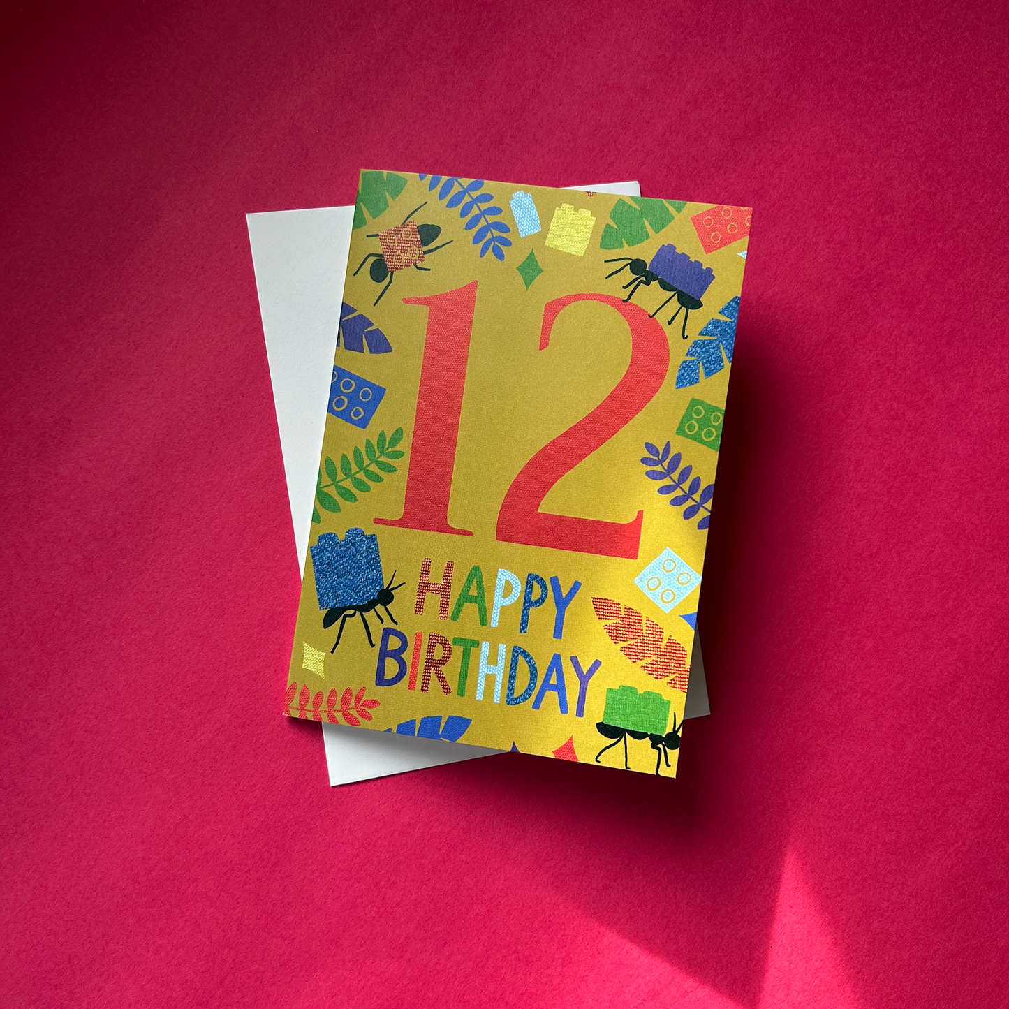 Colourful birthday card with number 12 and 'Happy Birthday' text on a red background