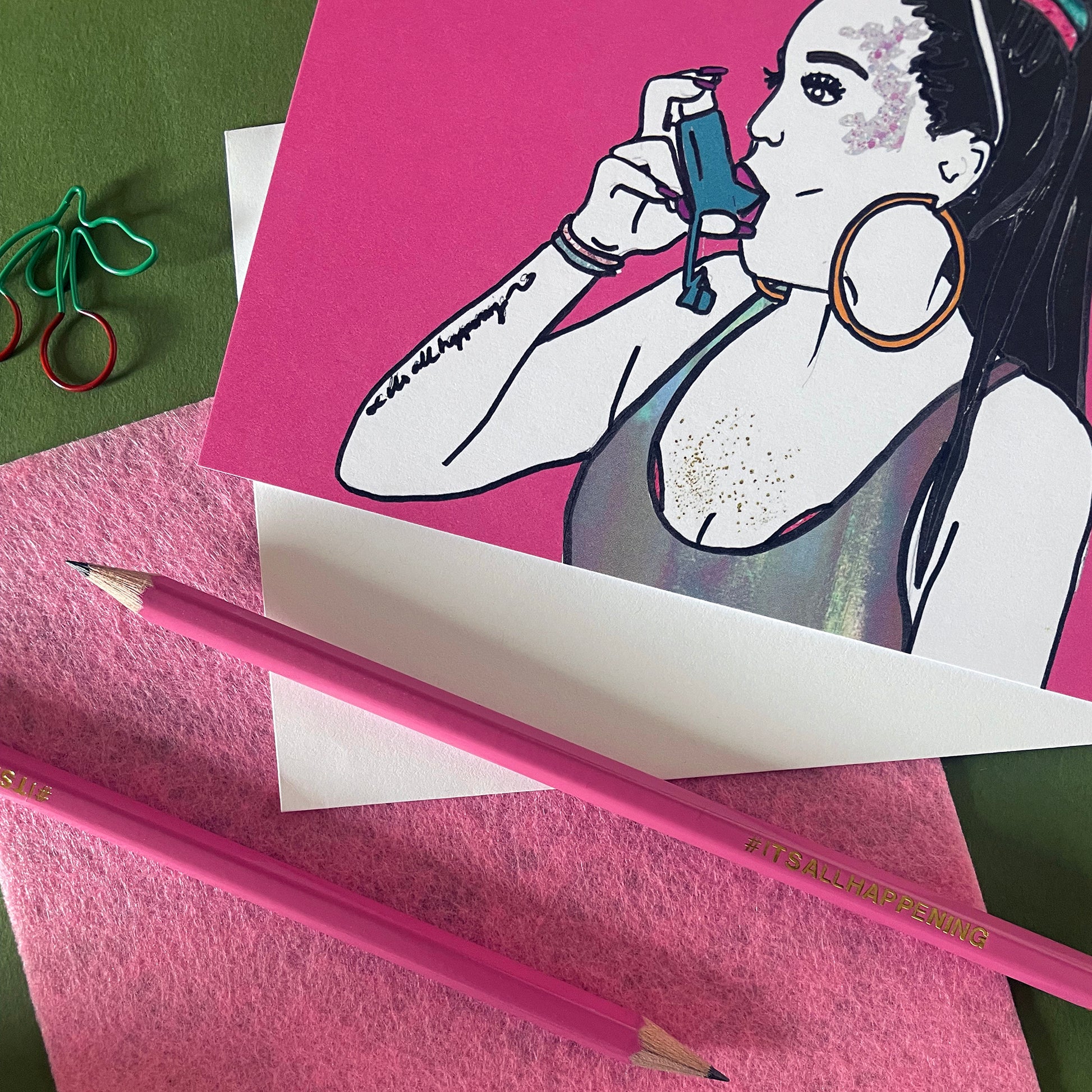 Image shows a pink pencil with gold lettering that says #itsallhappening