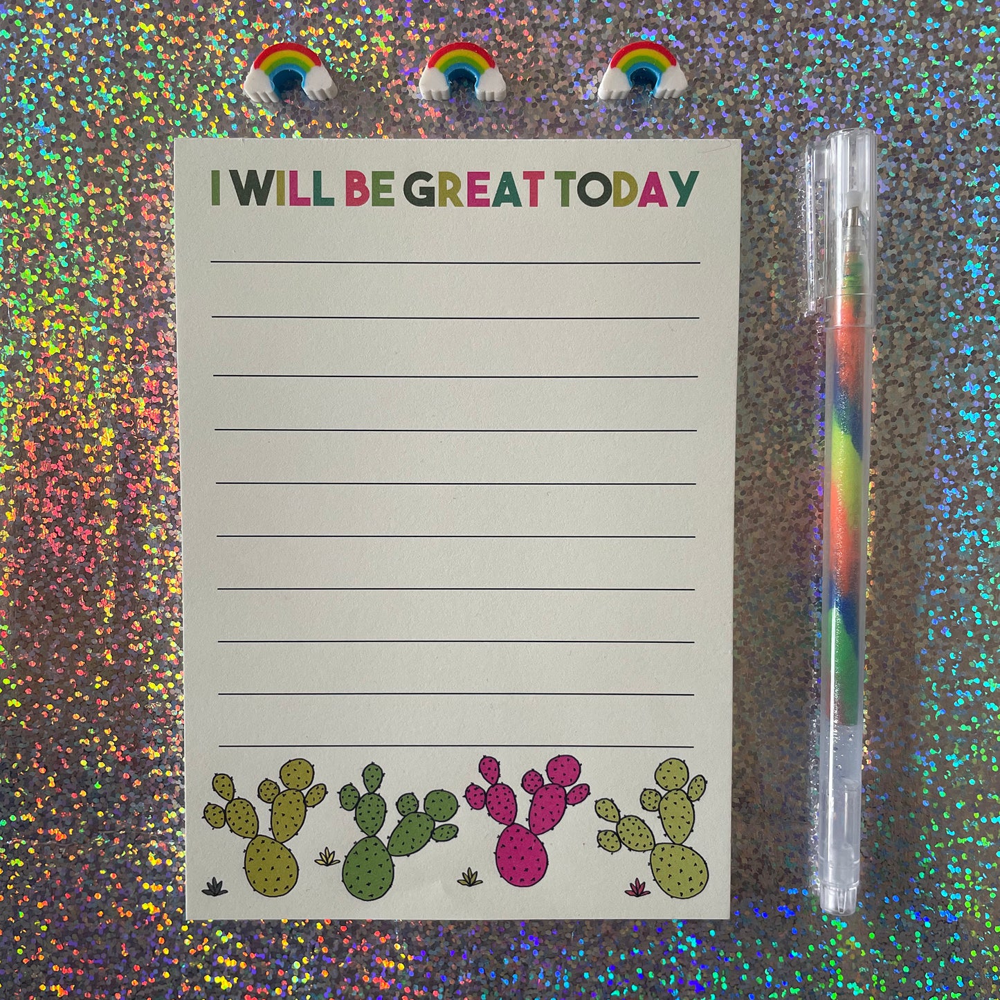 Image shows a lined a6 notepad with neon cactus illustrations and the words 'I will be great today'
