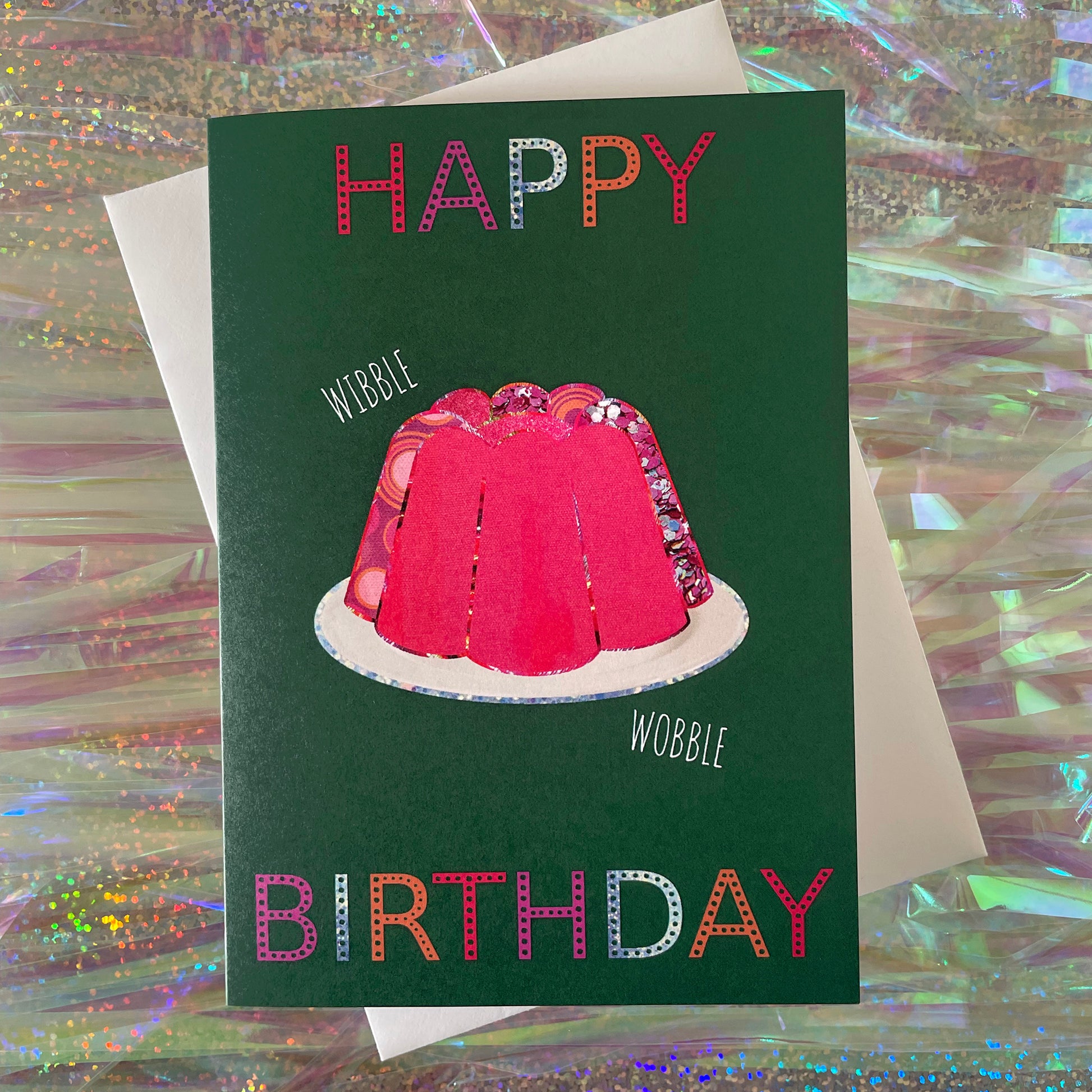 Image shows a green birthday card with a pink collaged jelly and 'Happy Birthday' in colourful lettering.
