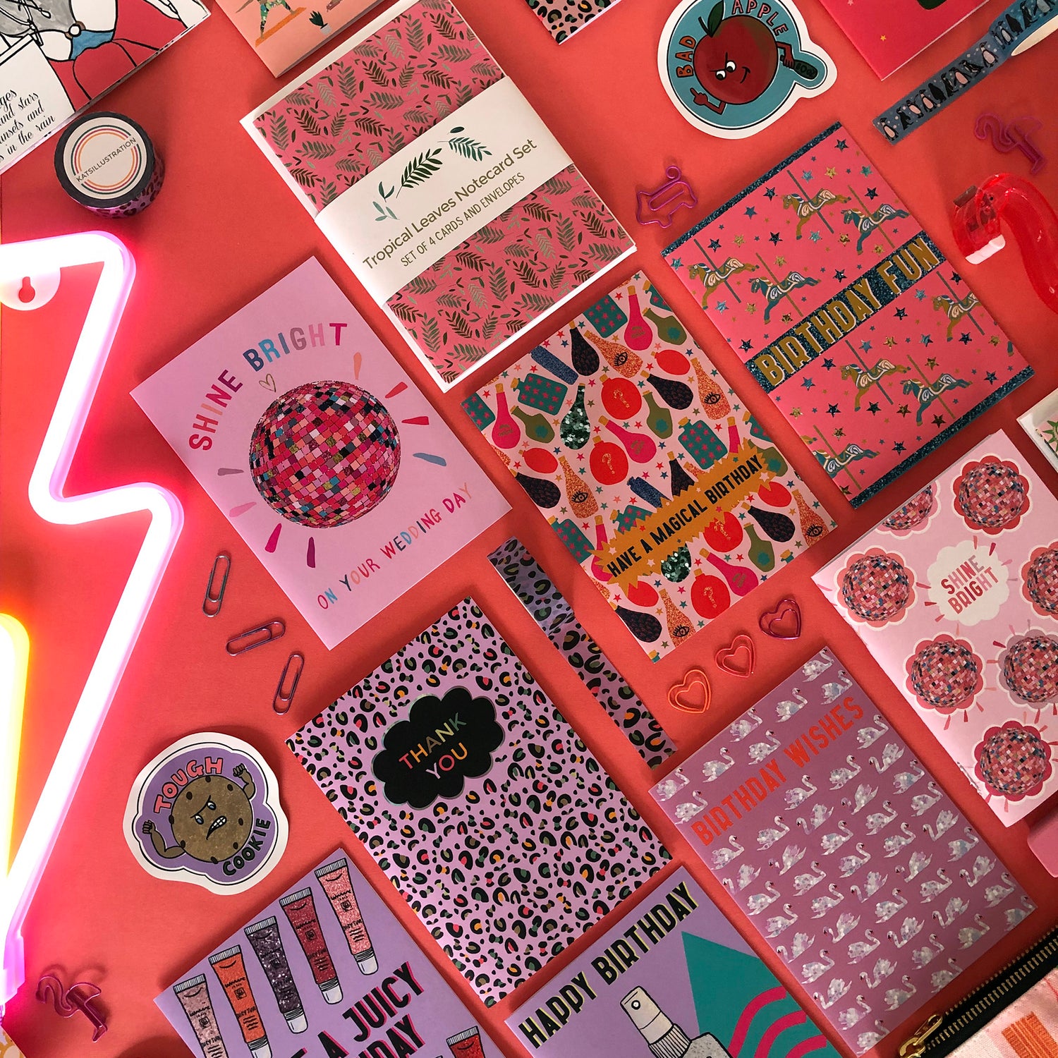 A curated collection of Katsillustration products in pinks and lilacs including cards, stickers and washi tape