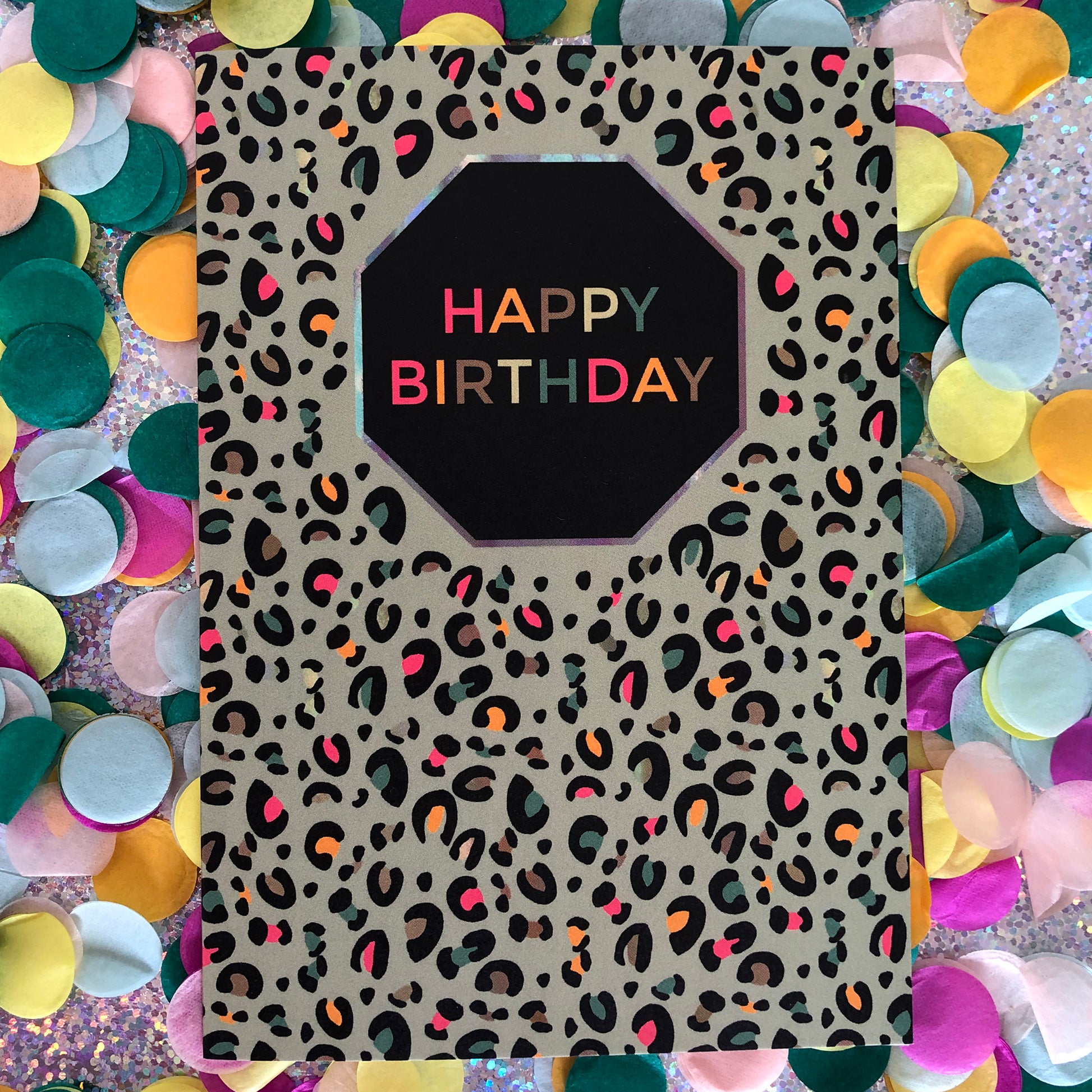 Image shows a fun Happy Birthday card with pale green leopard print and pops of neon.