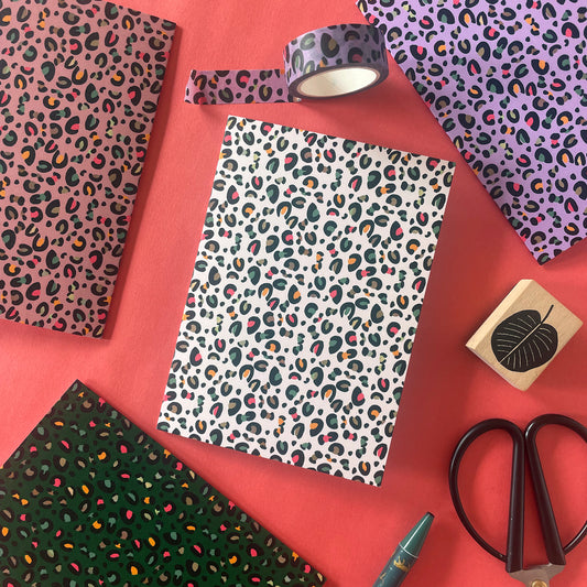 Image shows a set of 4 leopard print notecards each in a different fun colour with pops of neon in the pattern
