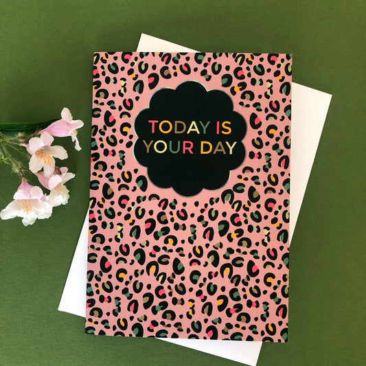 Image shows a greetings card with a pink leopard Print pattern and the words 'Today is your day '