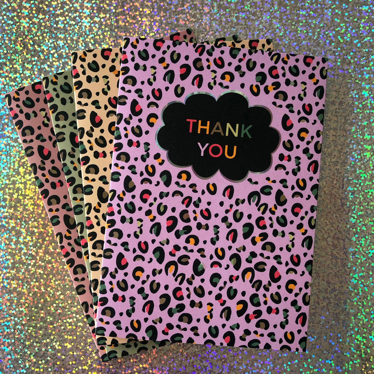 Image of a leopard Print Thank you card with lilac print and pops of neon.