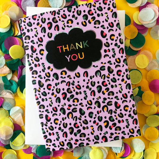 Image of a leopard Print Thank you card with lilac print and pops of neon.