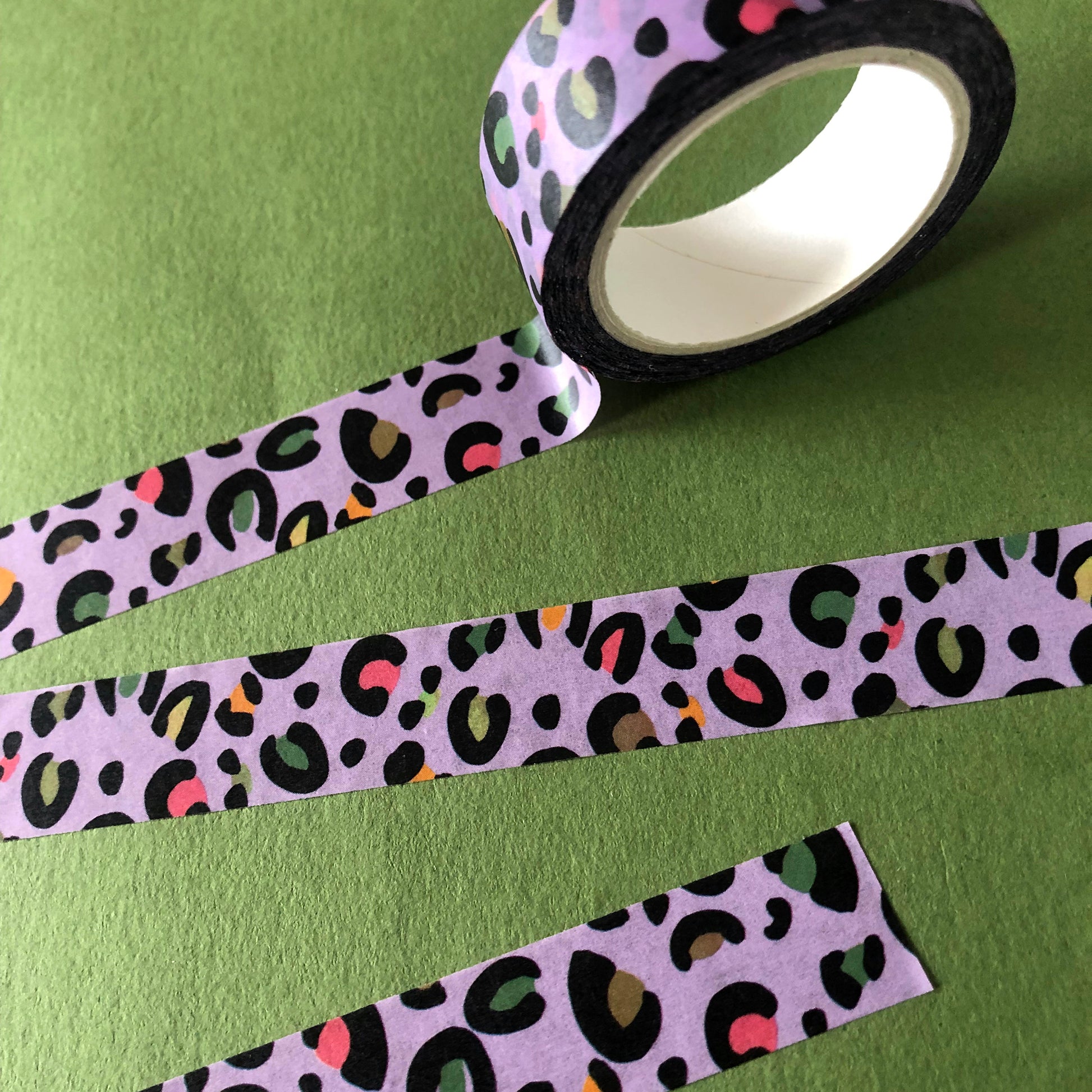 Image shows a purple leopard print washi tape with pops of neon colour