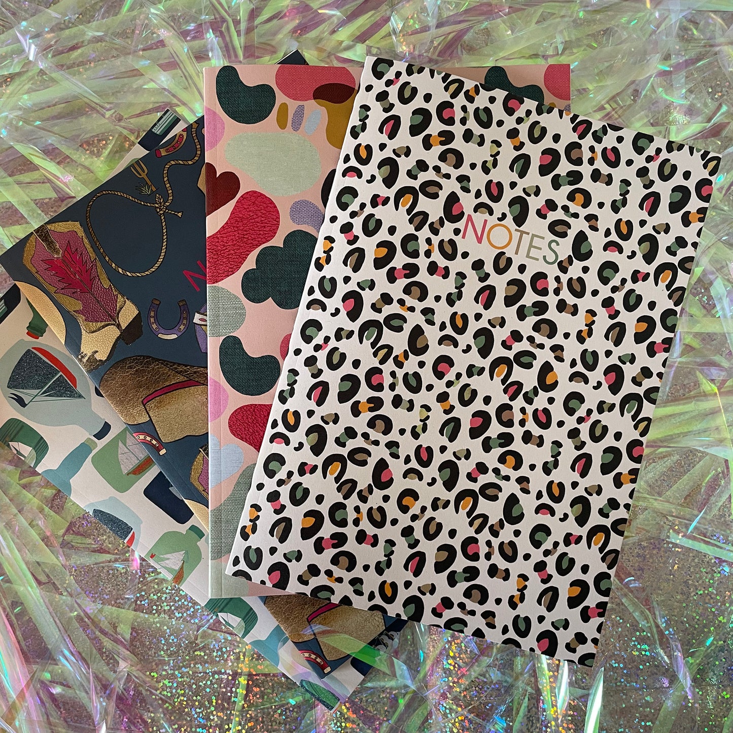 Image of a leopard print A5 size notebook in a cream colour with pops of neon.