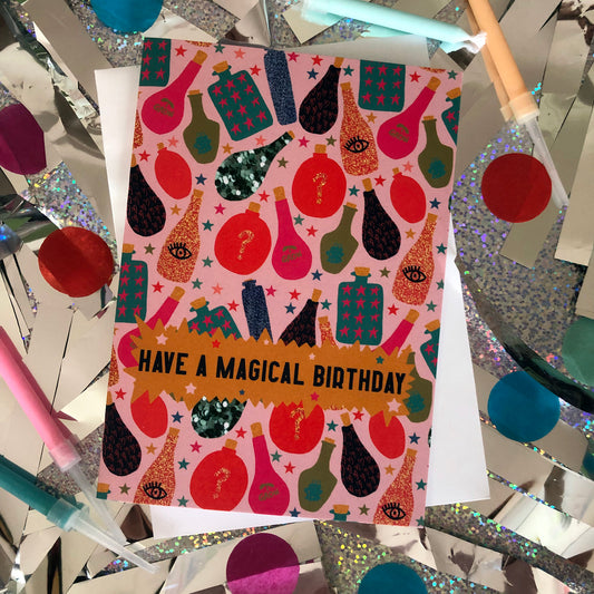 Image shows a fun, magical birthday card with colourful magic potion illustrations and the wording' have a magical birthday'