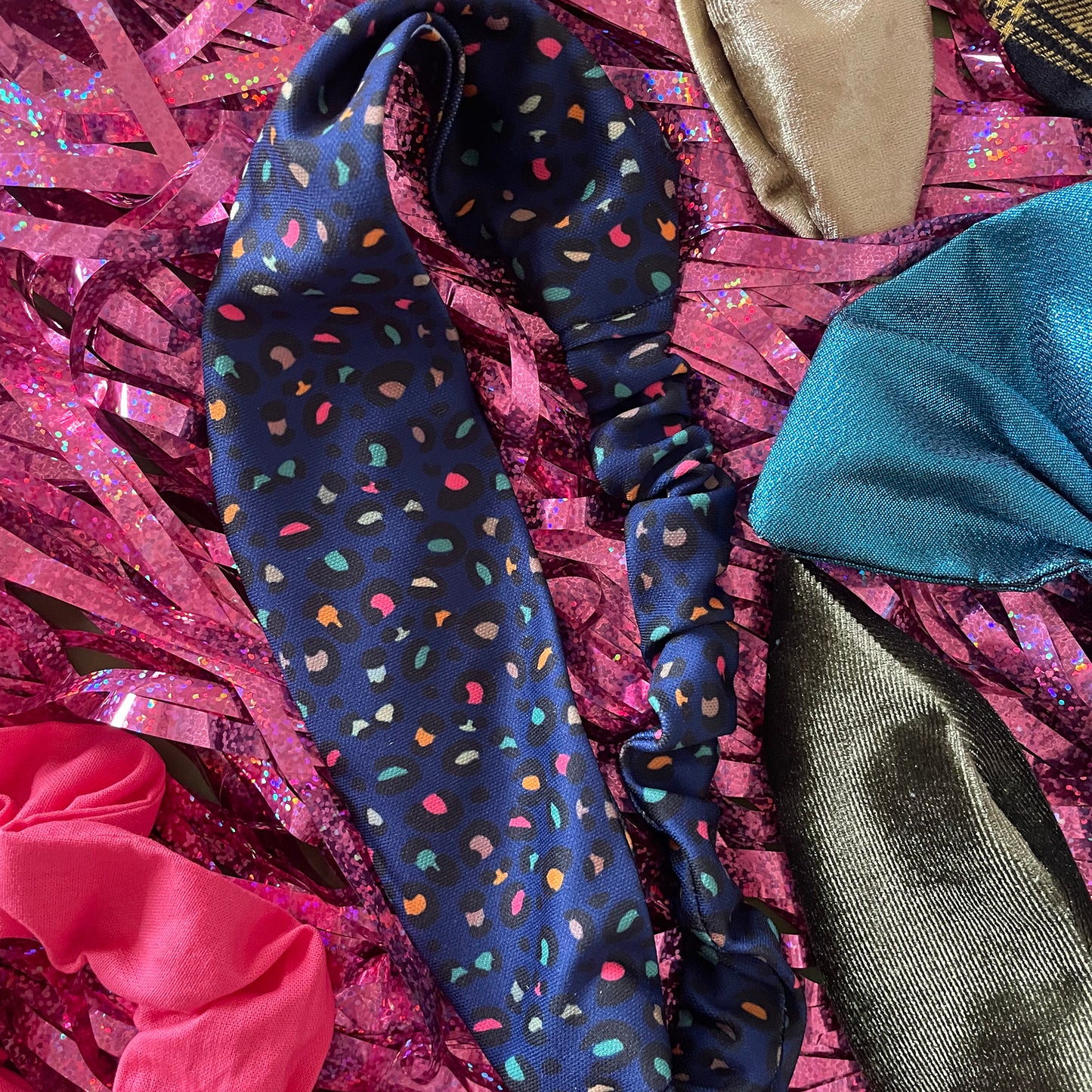Image shows a stunning midnight blue leopard print hair band.