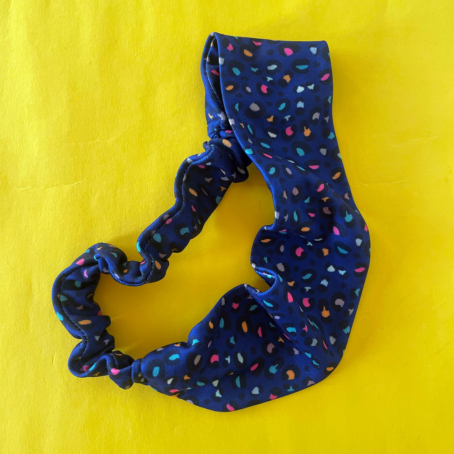 Image shows a stunning midnight blue leopard print hair band.