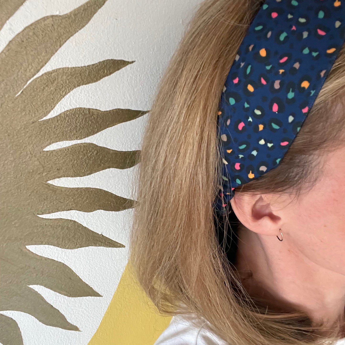 Image shows a stunning midnight blue leopard print hair band.