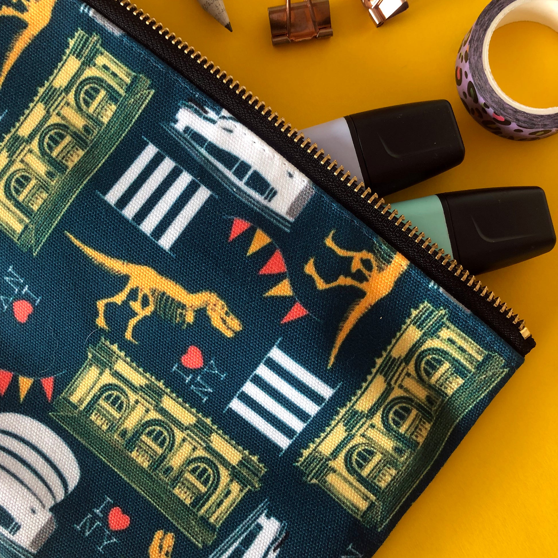 Image of a handy zip pouch in navy blue featuring unique illustrations of New York museums and galleries.