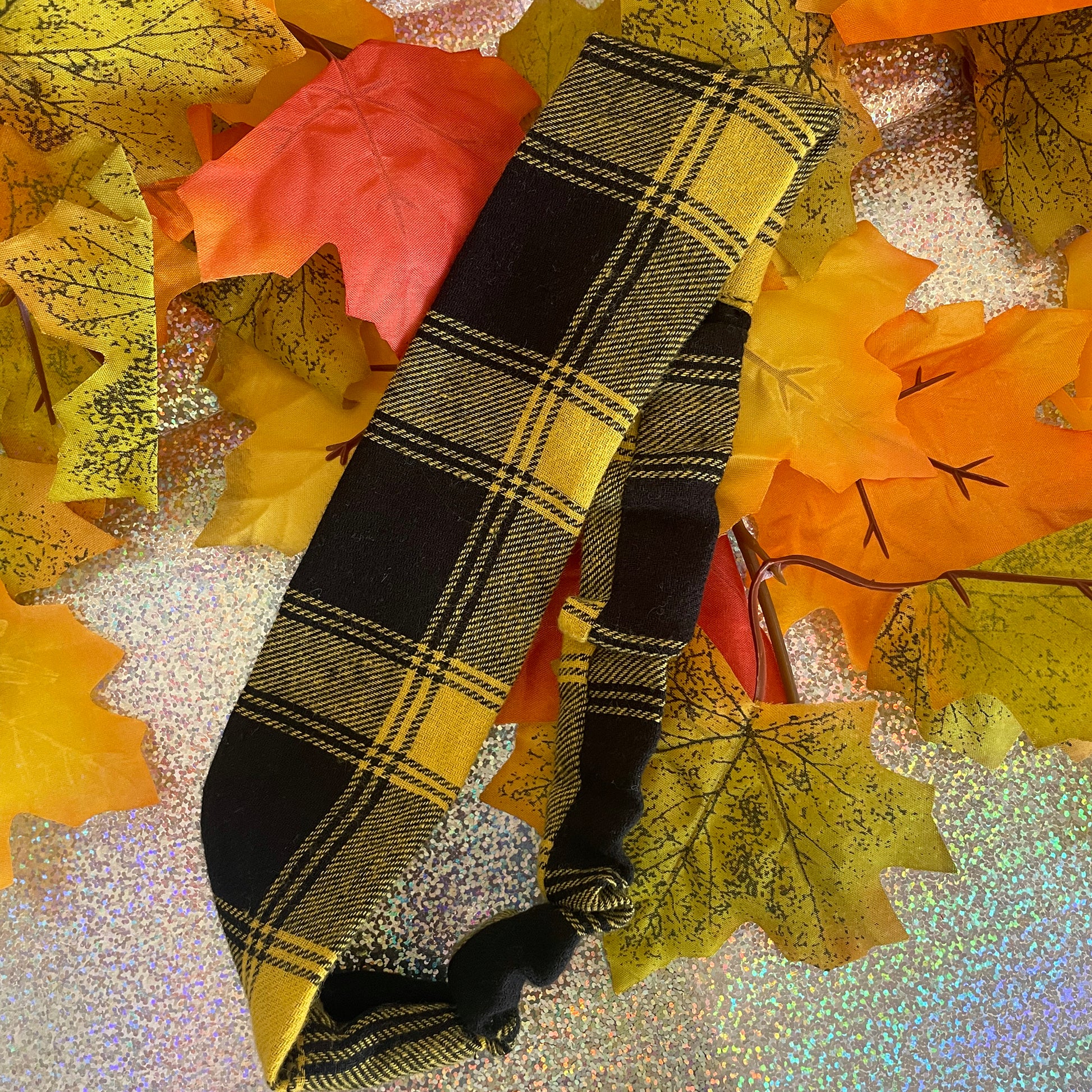 Image shows a super soft mustard plaid hair band.