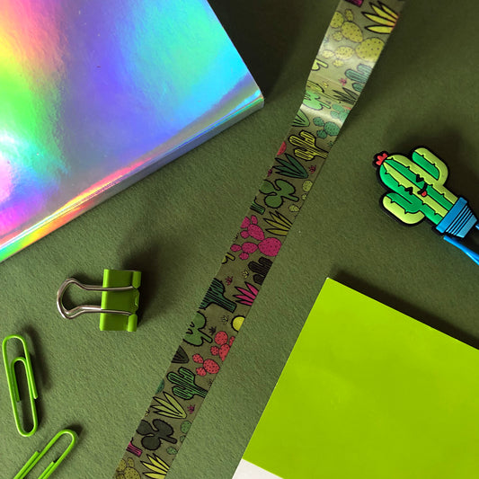 Image shows a green washi tape with a colourful cactus plant print