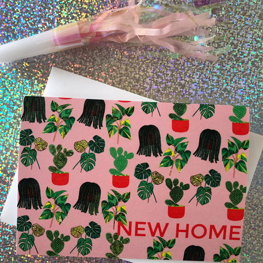 Image shows a pastel pink new home card with a pattern of illustrated green house plants and orange pots and writing.