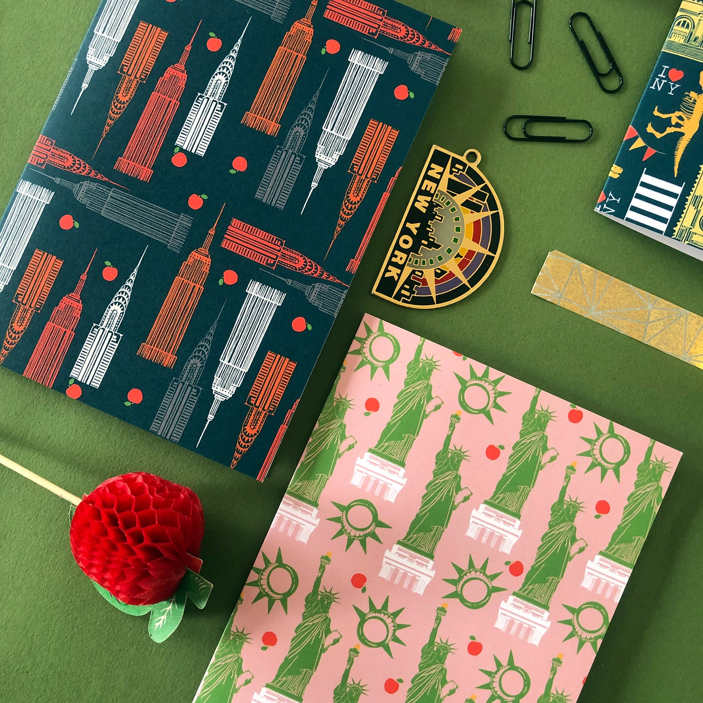 Image shows 2 graphic notecards inspired by skyscrapers and the statue of liberty of New York City.